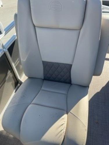 2024 Sun Tracker Fishin' Barge 20 DLX boat seat, gray upholstery.