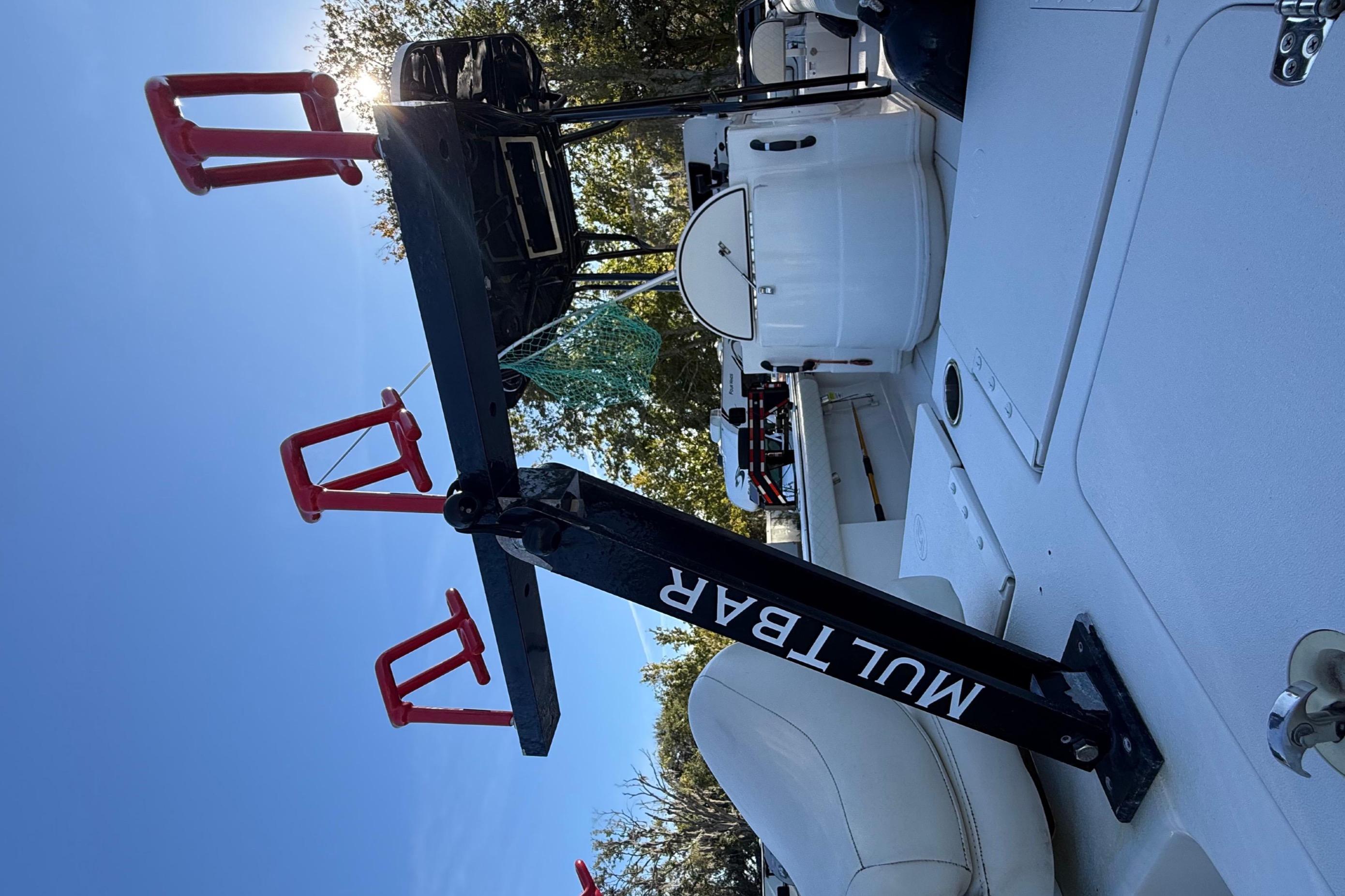2021 Carolina Skiff 26 Ultra Elite boat deck with fishing rod holders.