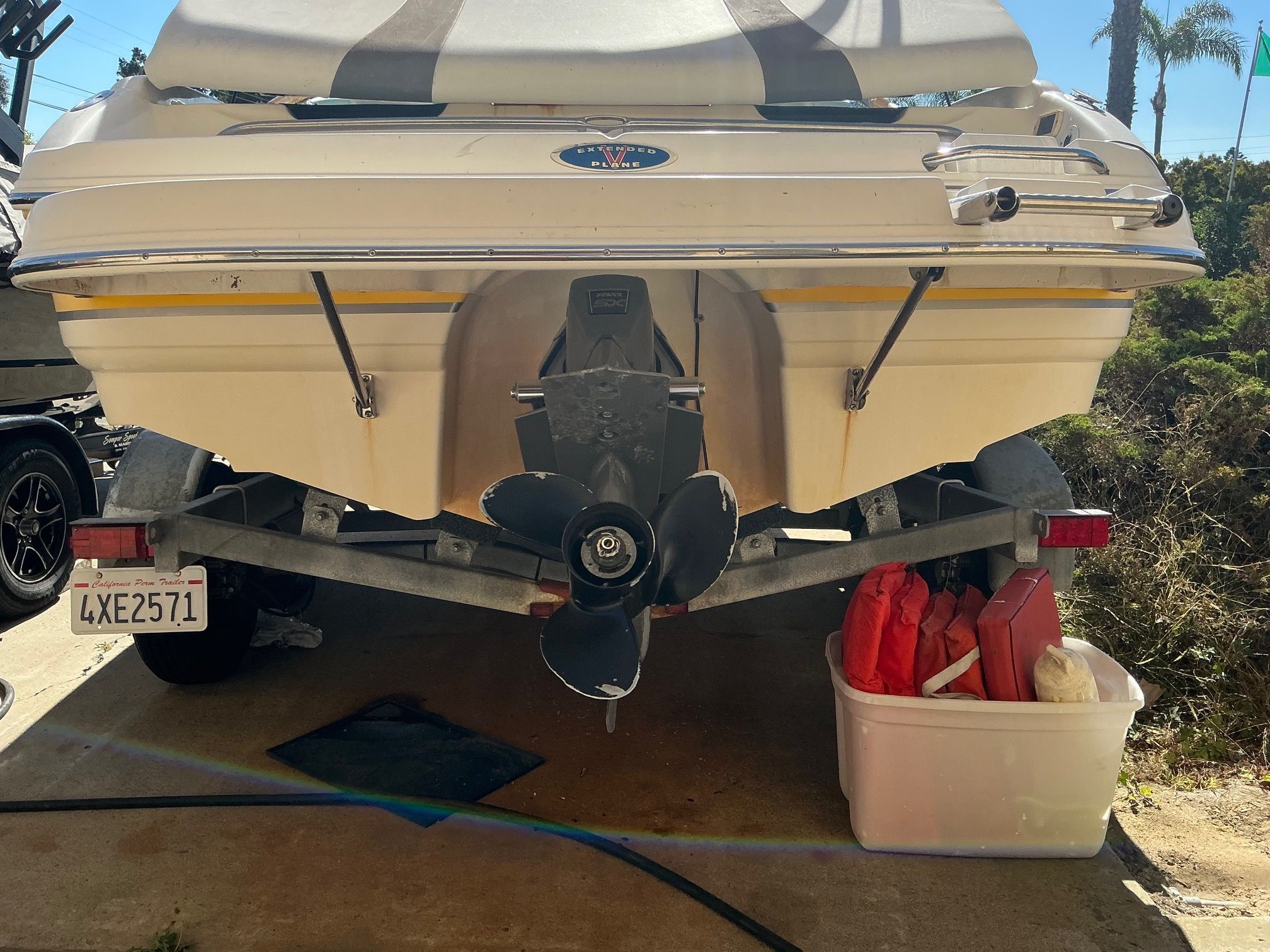 The image shows the rear of a 2003 Chaparral 210 SS boat on a trailer.