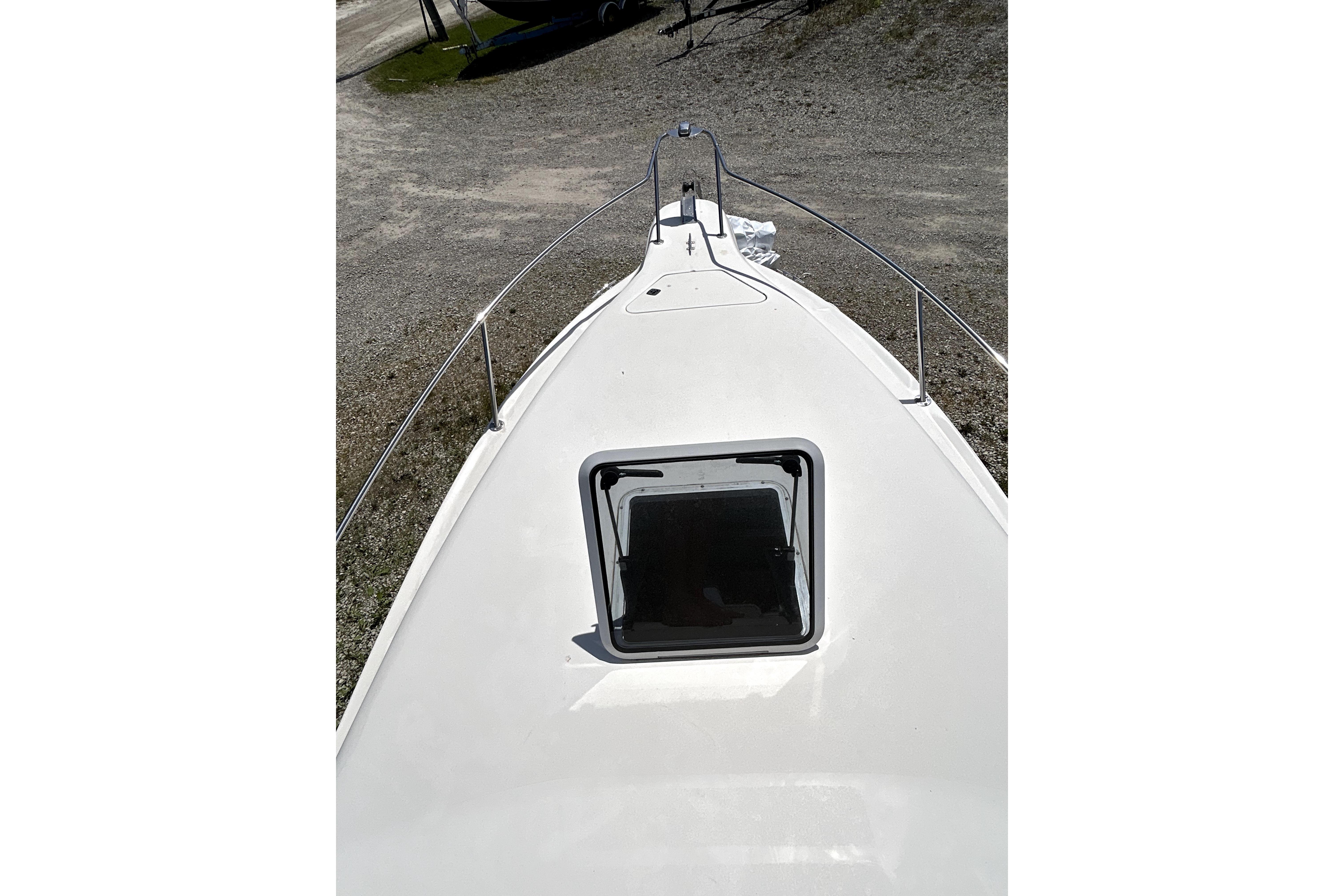 1995 Sea Ray 250 Sundancer boat deck with open hatch, viewed from above.