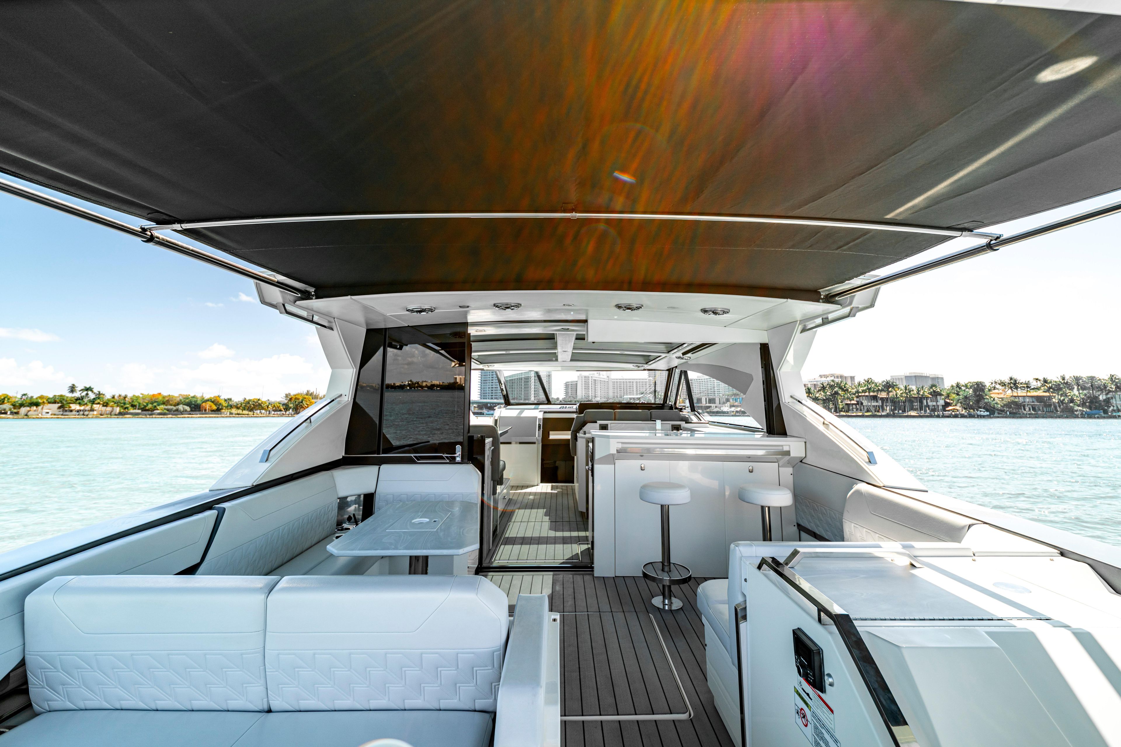 Luxurious 2022 Formula 500 Super Sport Crossover yacht interior with seating and ocean view.