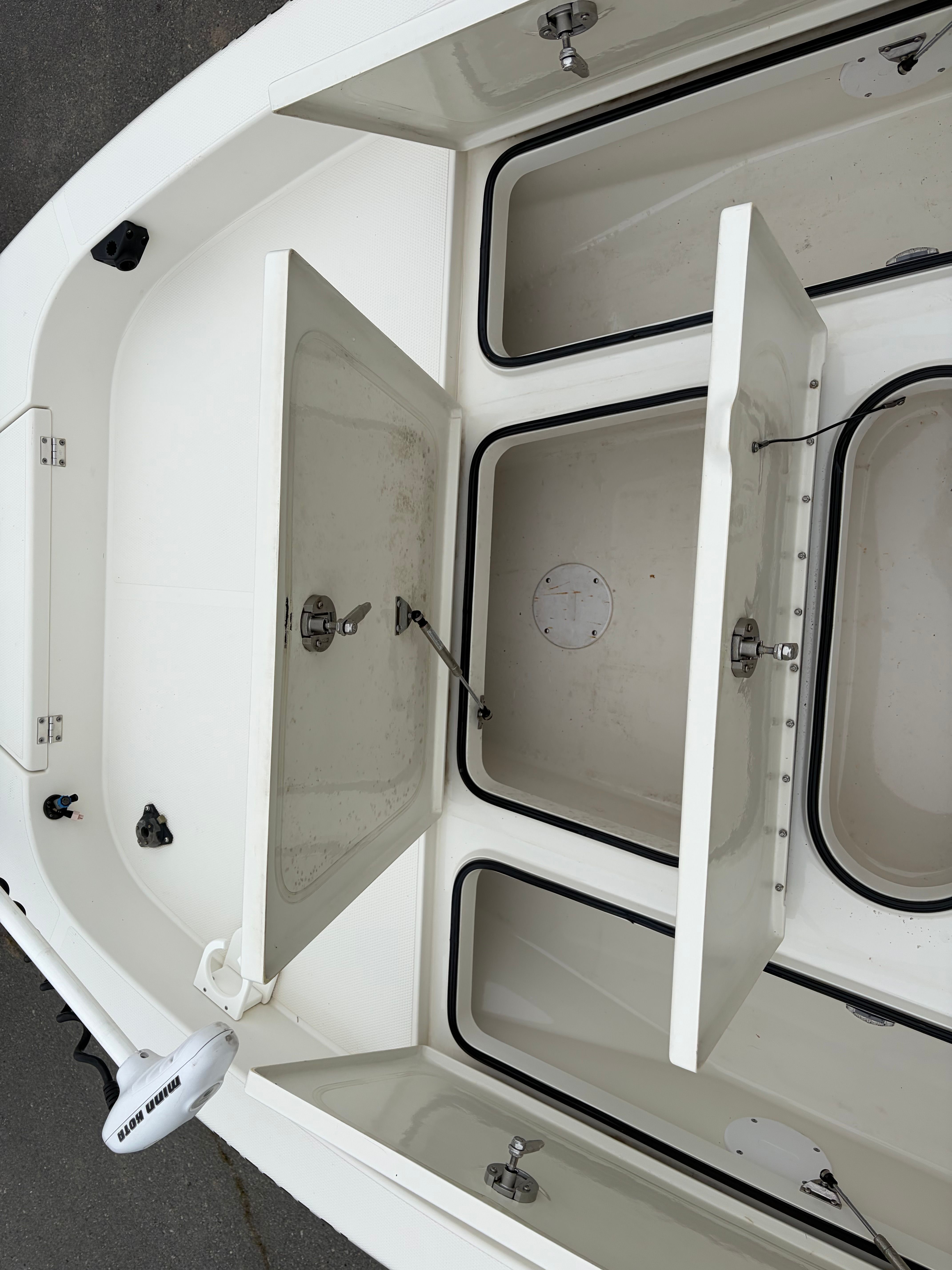 Open storage compartments on a 2008 Ranger 2400 Bay Ranger boat.
