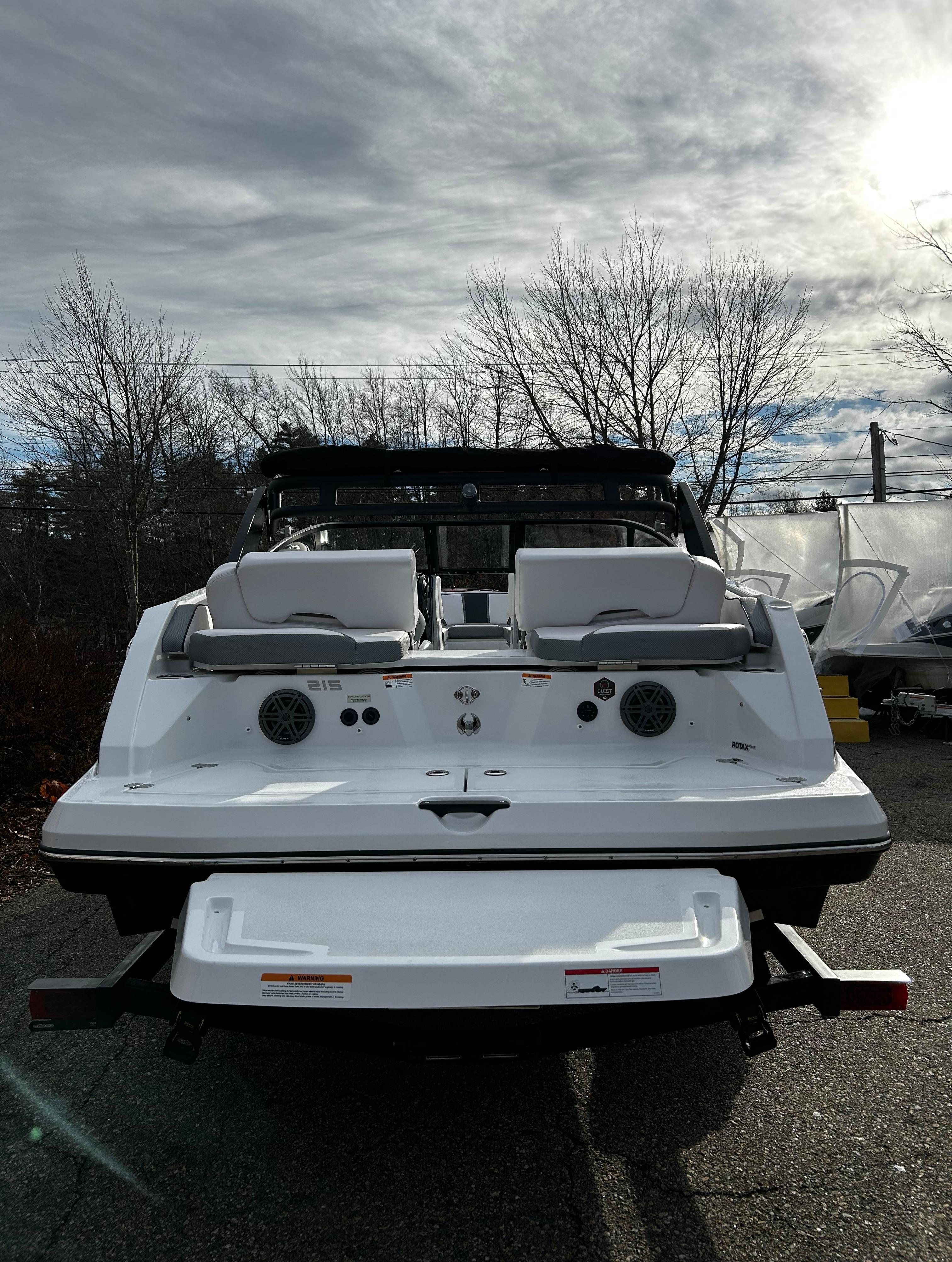 2024 Scarab 215 Wake LE boat rear view with seating and speakers.