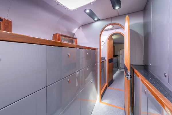 Interior of 2025 Shuttleworth 52 AeroRig yacht, featuring sleek cabinetry and modern design.