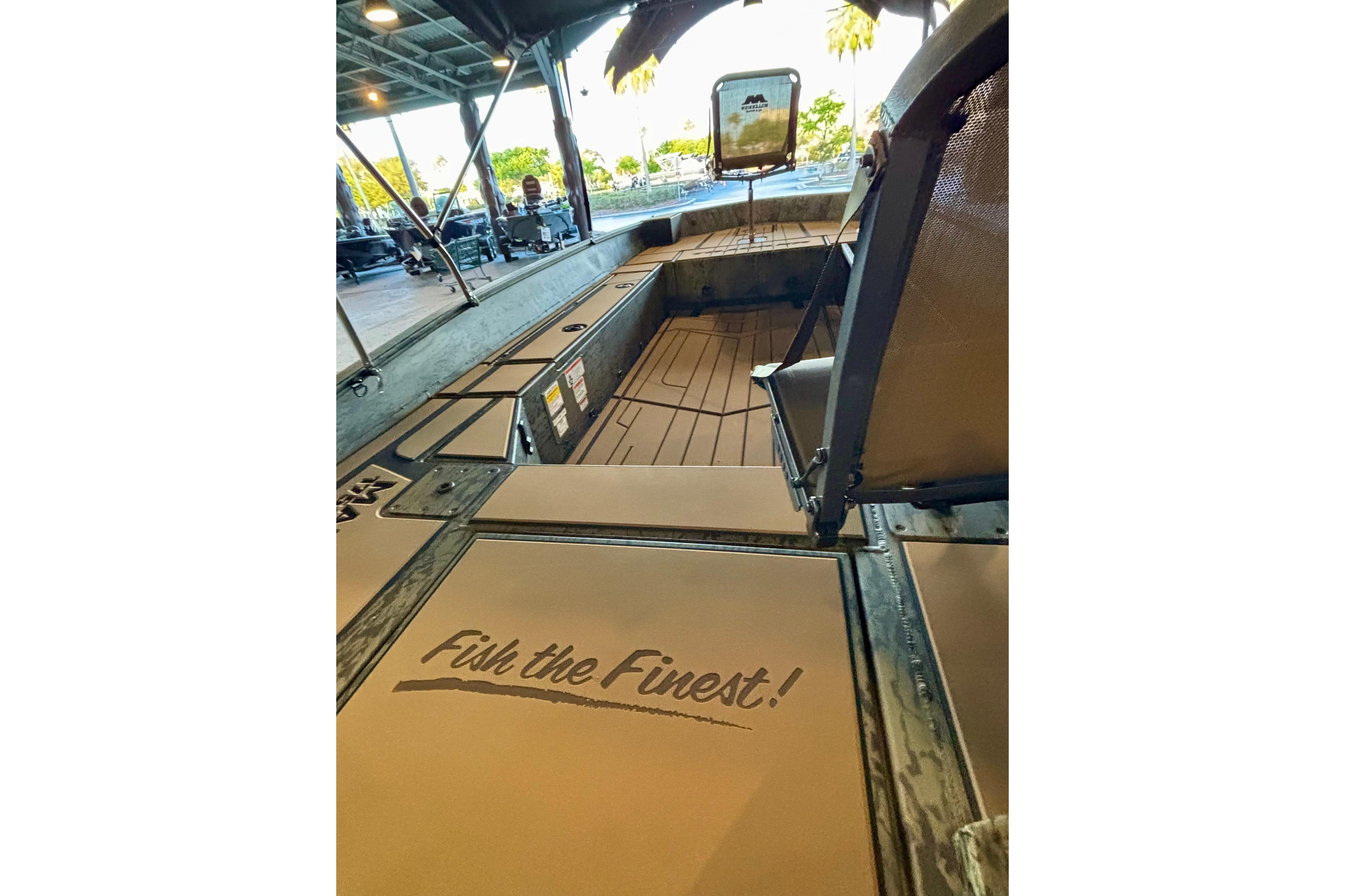 2026 Tracker Grizzly 1756 T Marsh boat interior with "Fish the Finest!" slogan.