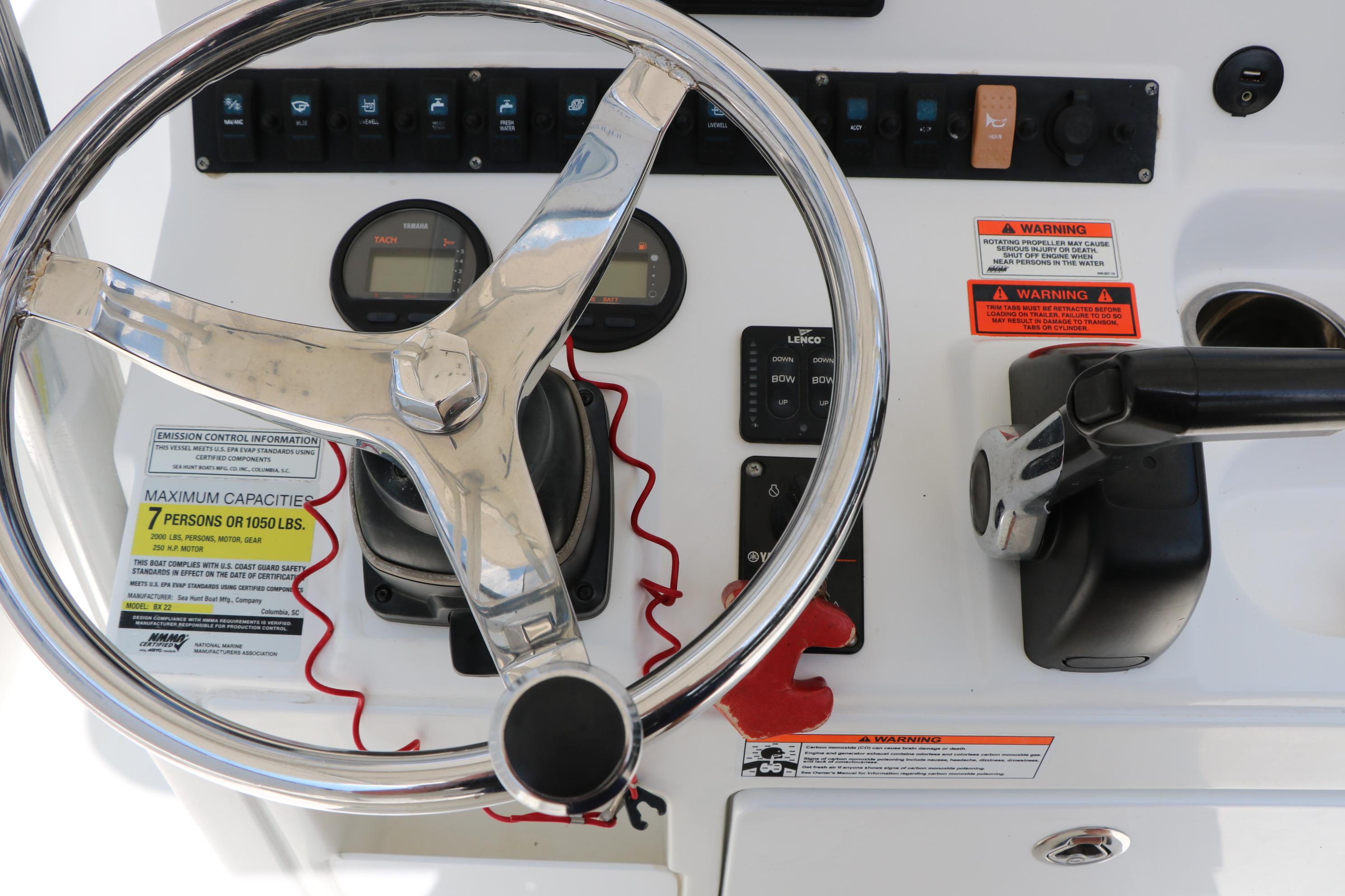 2015 Sea Hunt BX 22 BR boat dashboard with steering wheel and controls.