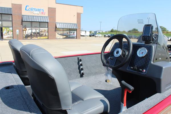 2025 Tracker Bass Tracker Classic XL boat interior at dealership, featuring steering console and seating.