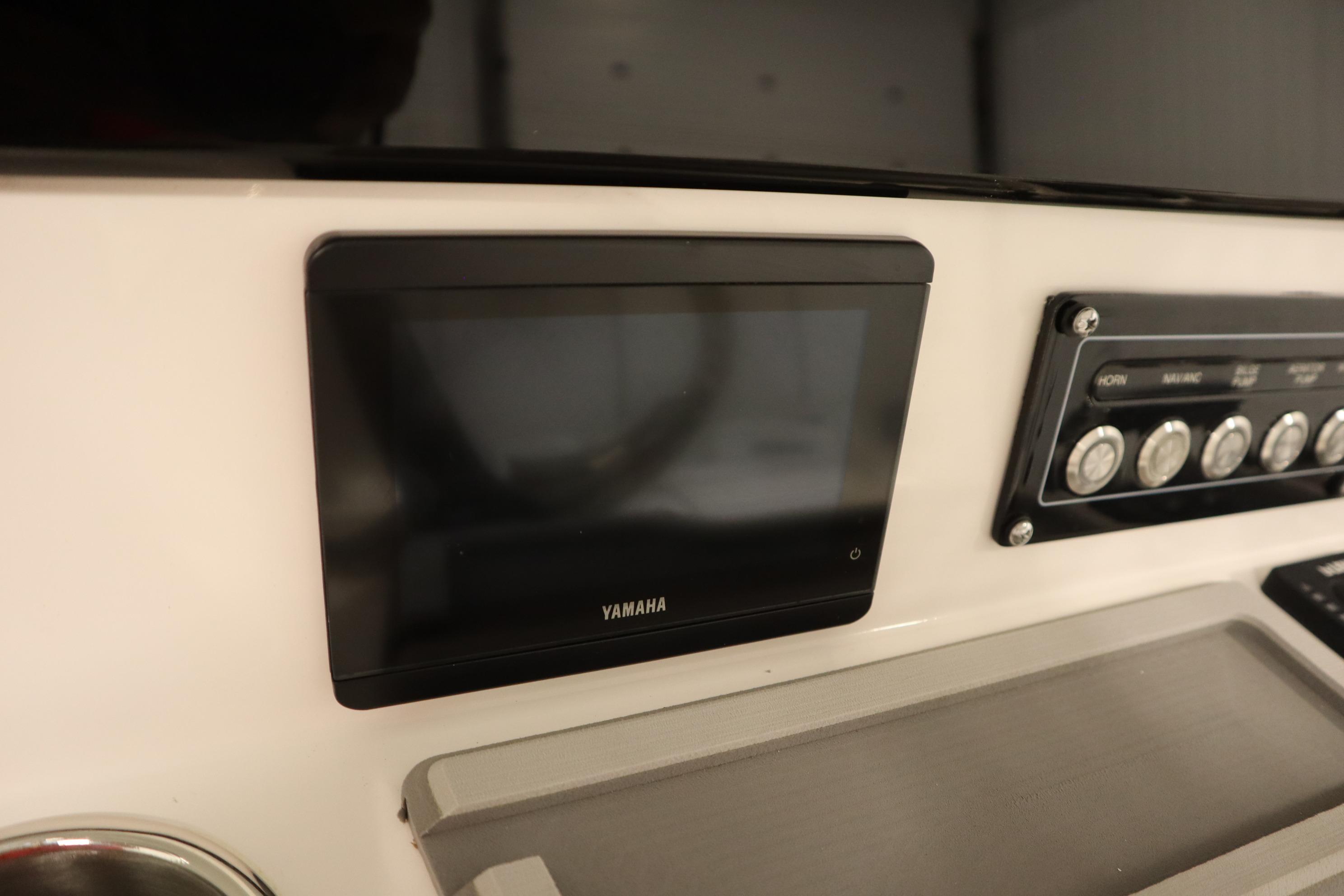 Dashboard of 2026 Sea Fox 228 Commander with Yamaha display and control panel.