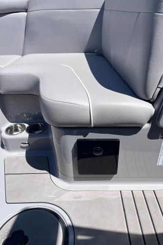 2024 Moomba Max boat interior with gray seating and cup holders.