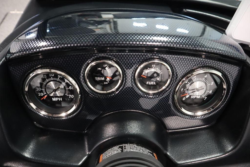 Dashboard of 2026 Lowe Fishing Machine 175 with speedometer, trim, fuel, and RPM gauges.