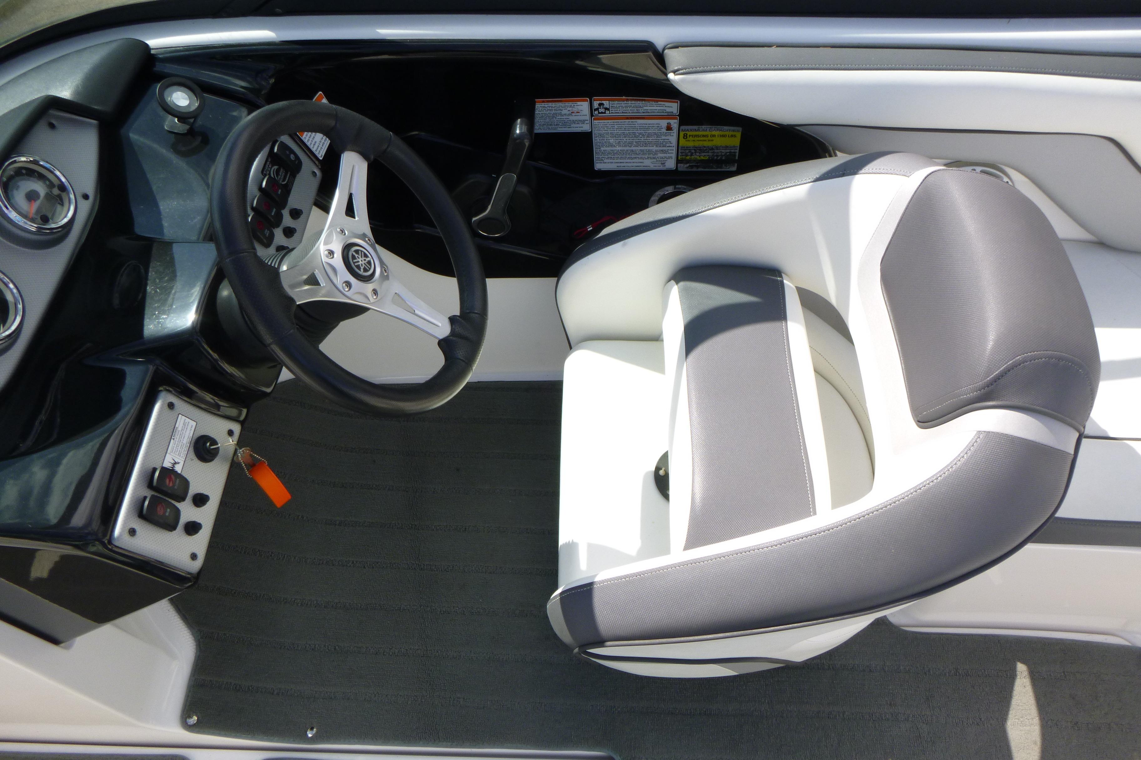 2015 Yamaha Boats SX192 cockpit with steering wheel and cushioned seat.