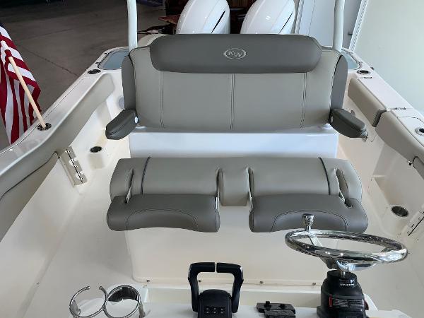 2024 Key West 263 FS boat interior with dual seats and steering wheel.