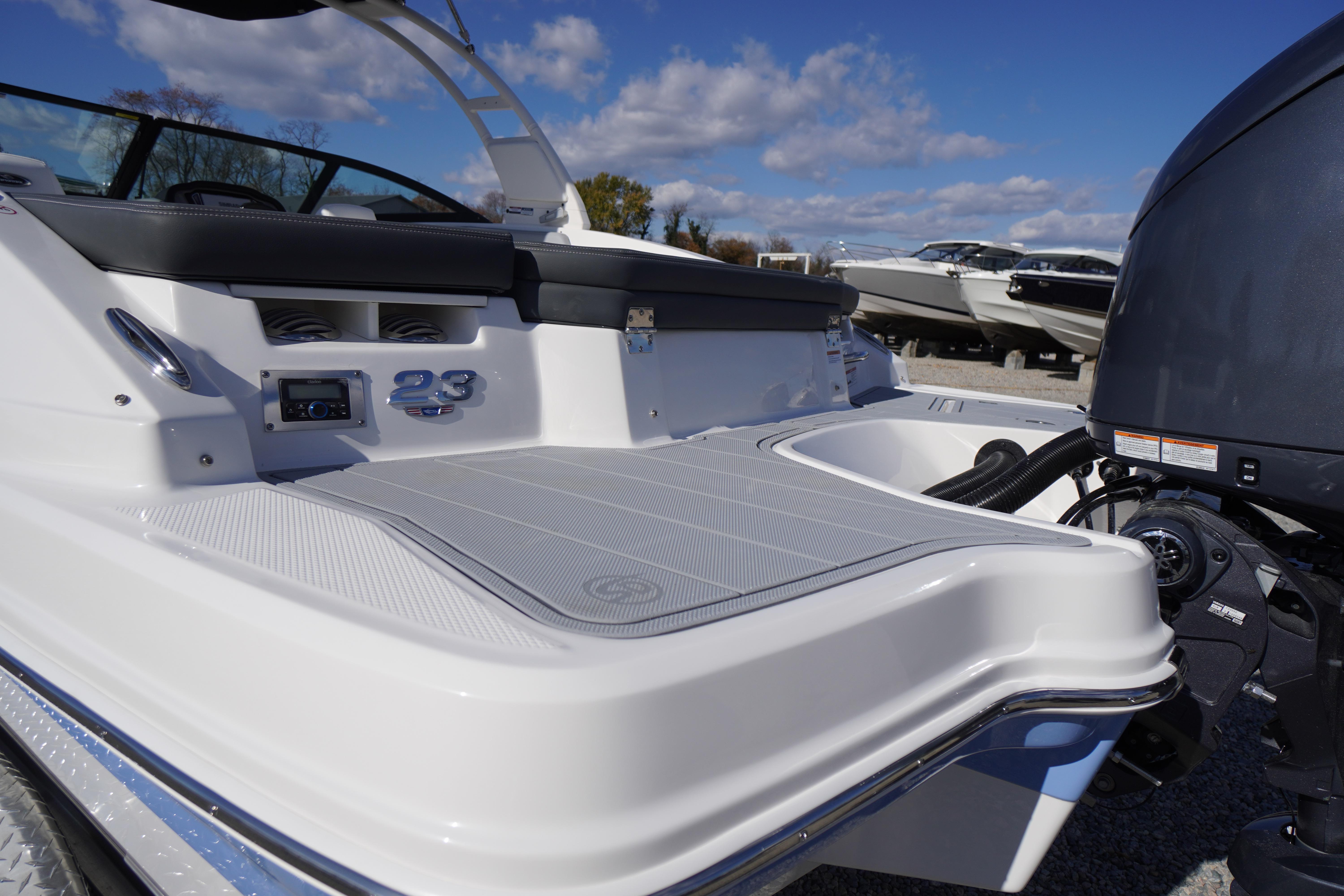 2026 Chaparral 23 SSi OB boat with sleek design and powerful outboard motor.