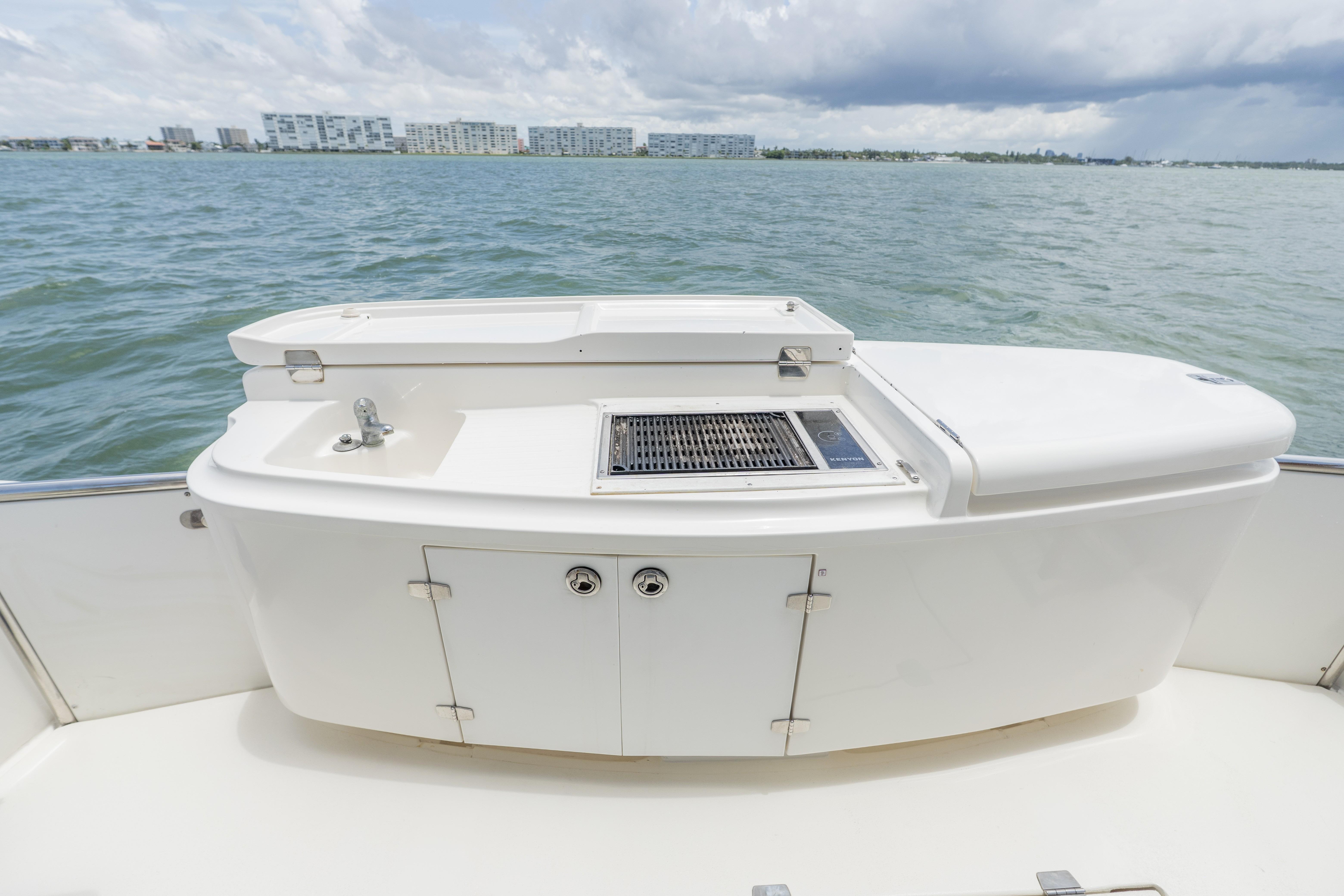 Outdoor kitchen on 2008 Maritimo 52 yacht with ocean view.