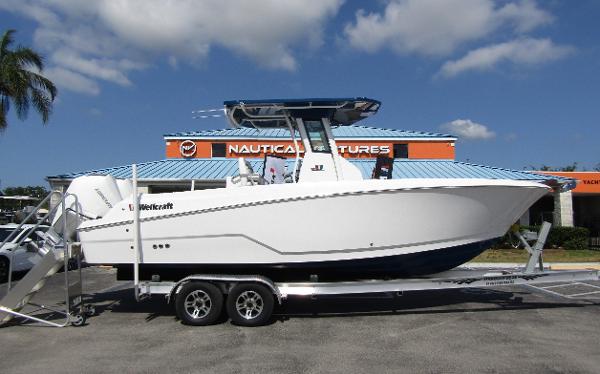 2024 Wellcraft 263 Fisherman boat on a trailer at a dealership.