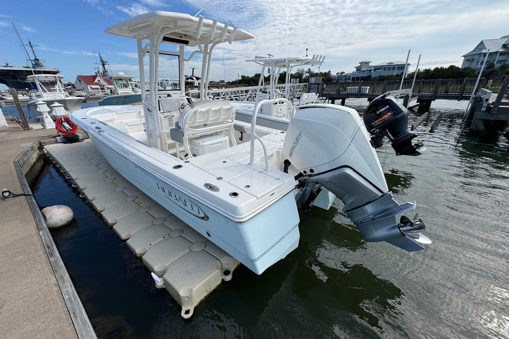 2021 Robalo 246 Cayman boat docked, featuring a Mercury outboard engine.