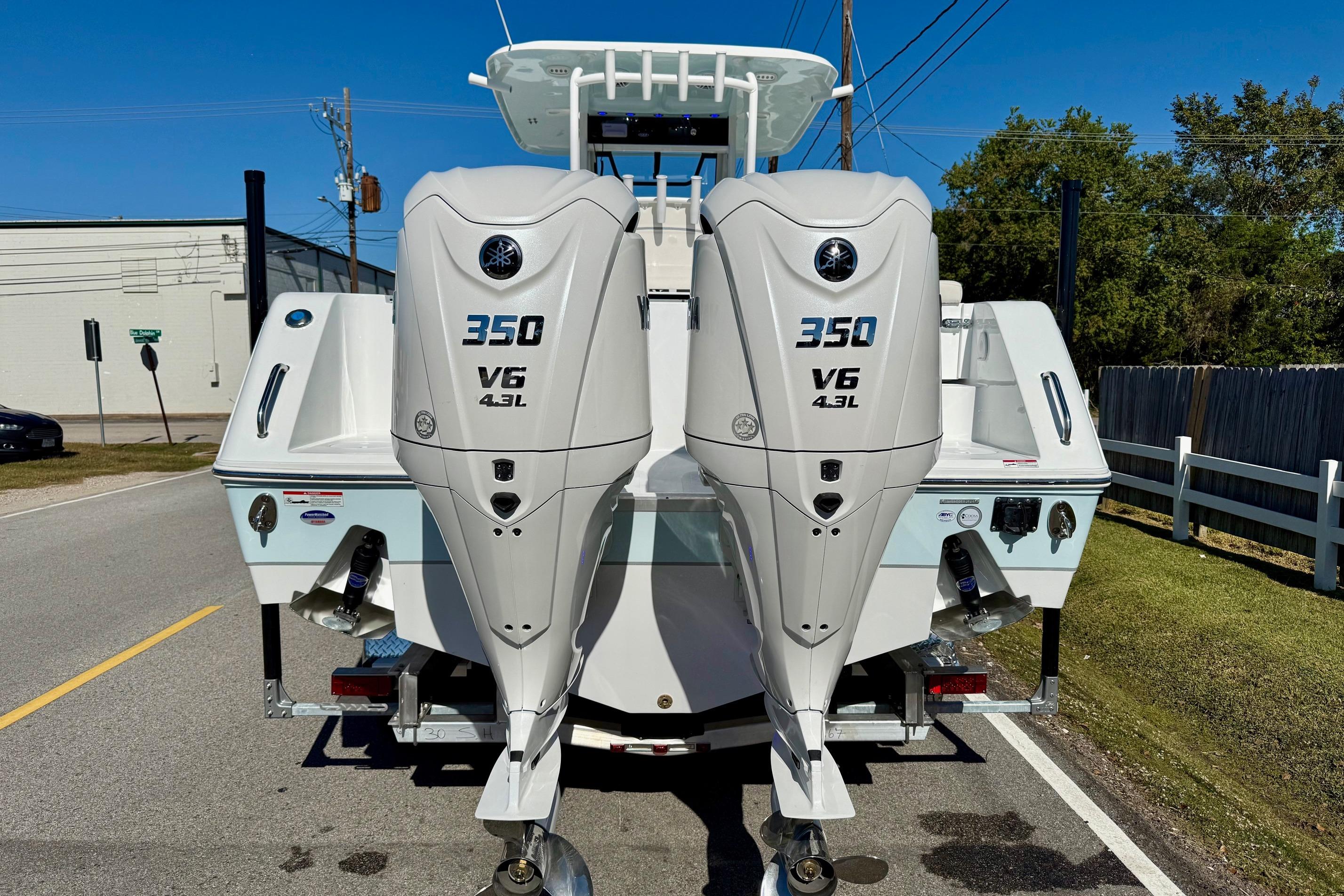 2026 Sea Hunt Gamefish 30 Coffin Box with twin 350 V6 engines, rear view.