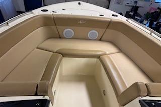 2021 Scout 215 Dorado boat interior with tan seating and built-in speakers.