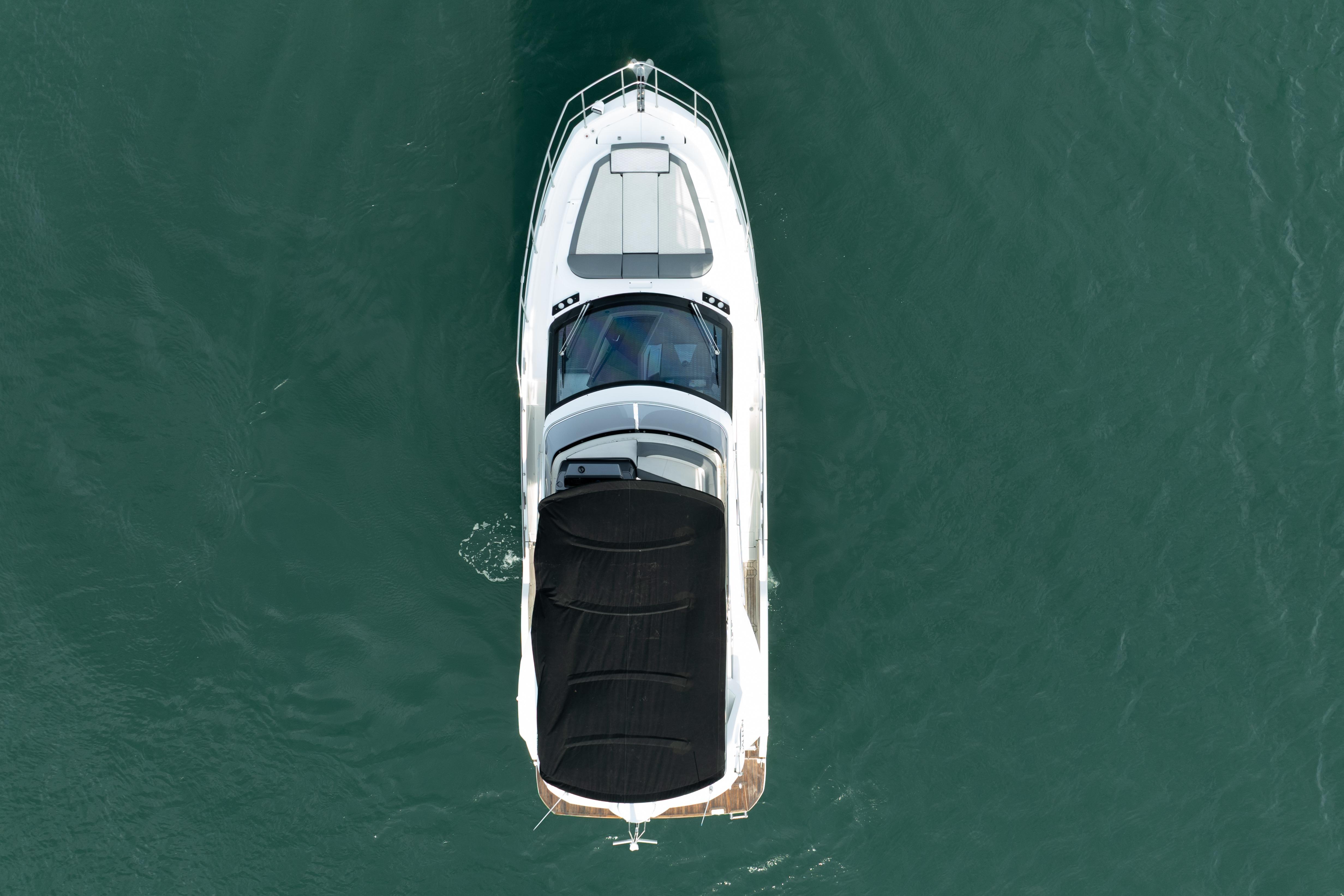 Aerial view of 2023 Galeon 400 Fly yacht cruising on open water.