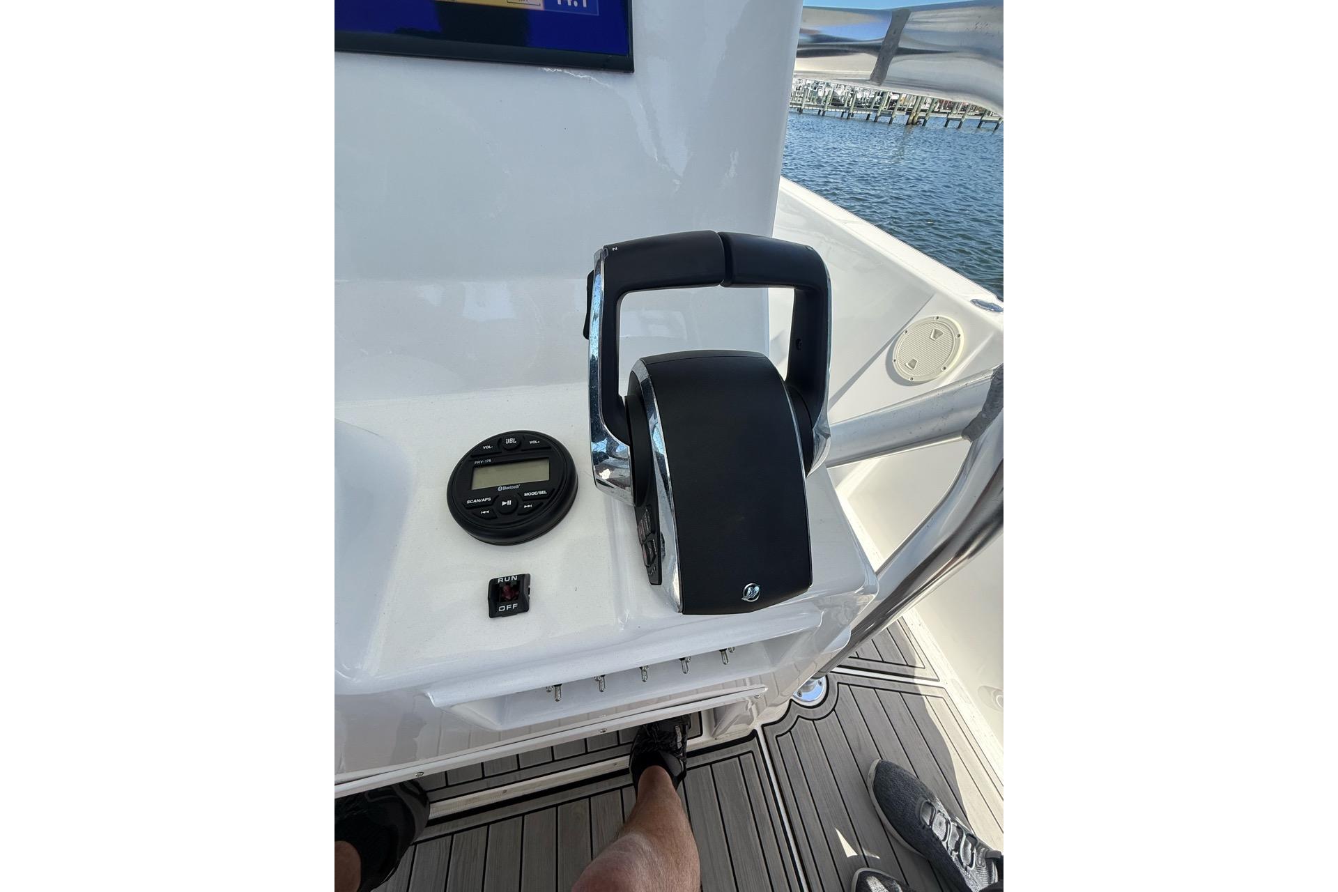 Control panel of 2021 Custom Infusion 34 CC boat with throttle and display.
