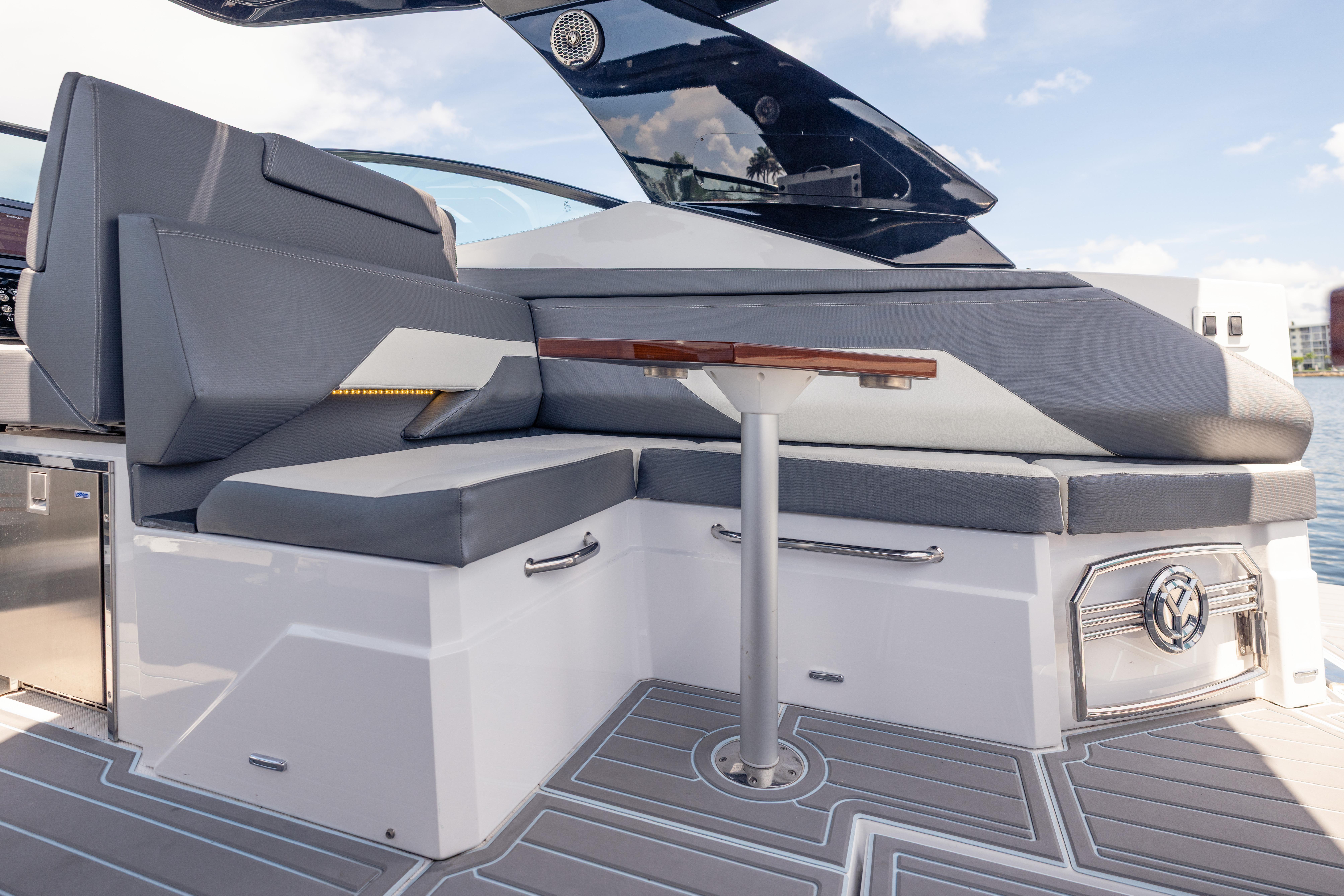 2021 Cruisers Yachts 38 GLS interior with sleek seating and modern table design.