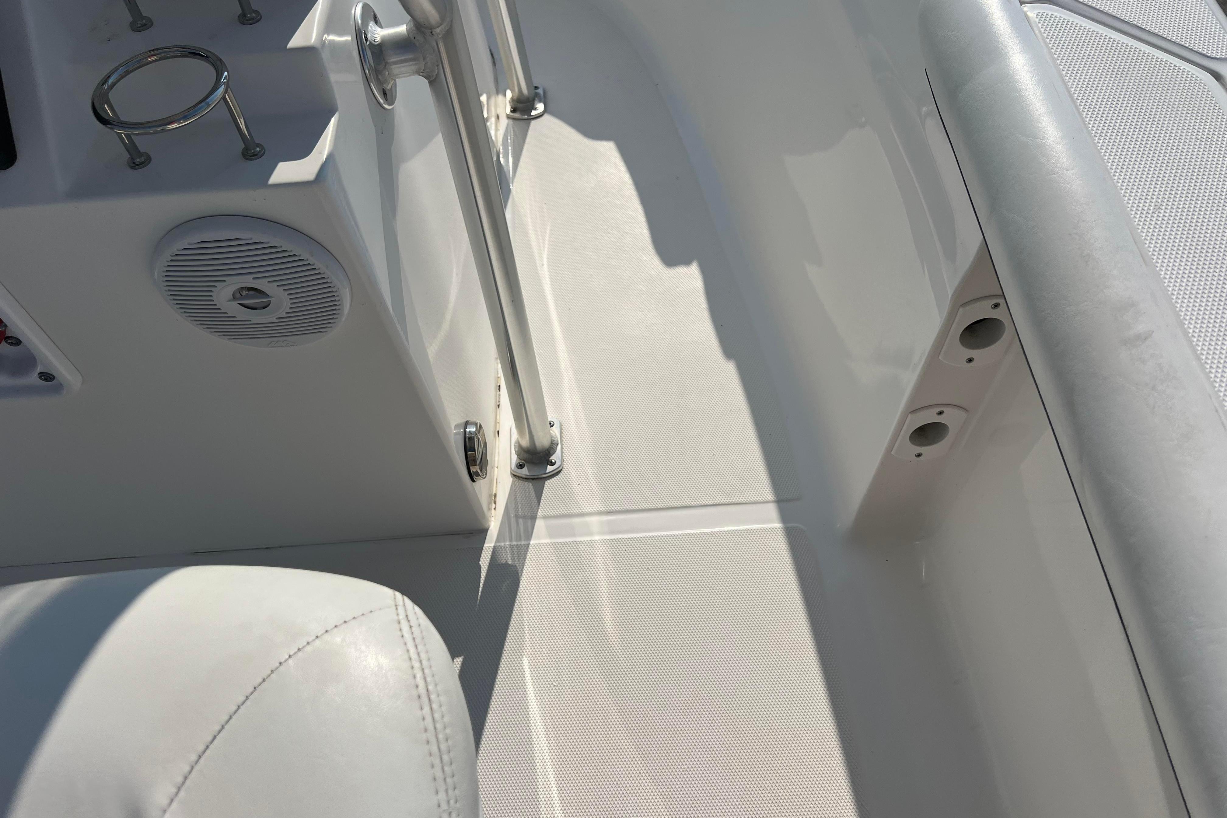Interior view of a 2012 Sea Fox 206 Center Console boat, featuring seating and speaker.
