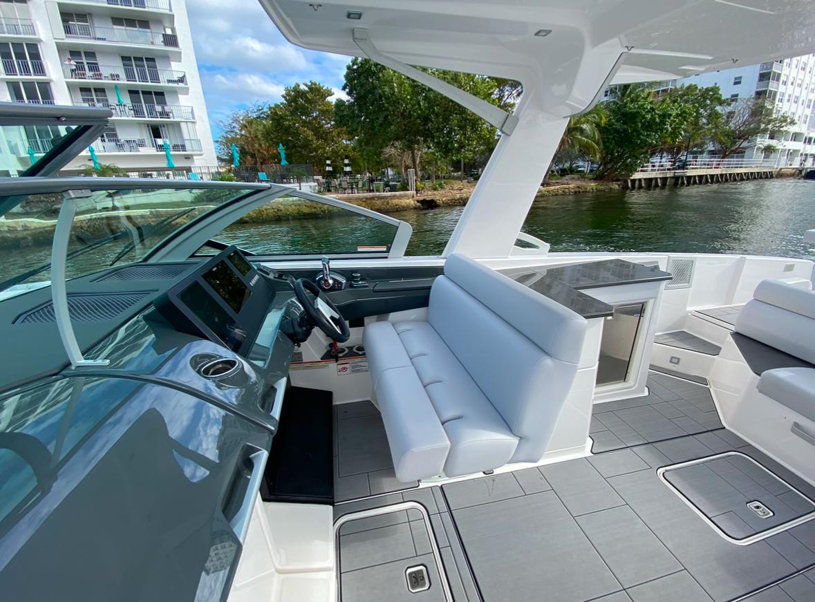 2024 Aviara AV32 OB boat interior with modern seating and sleek dashboard design.