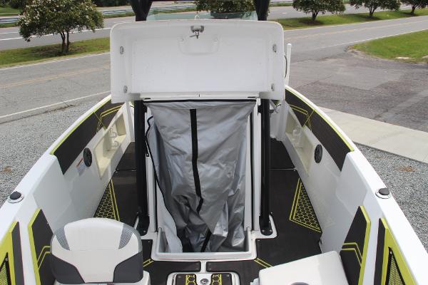 2023 Scarab 255 Open ID boat interior with storage compartment open.