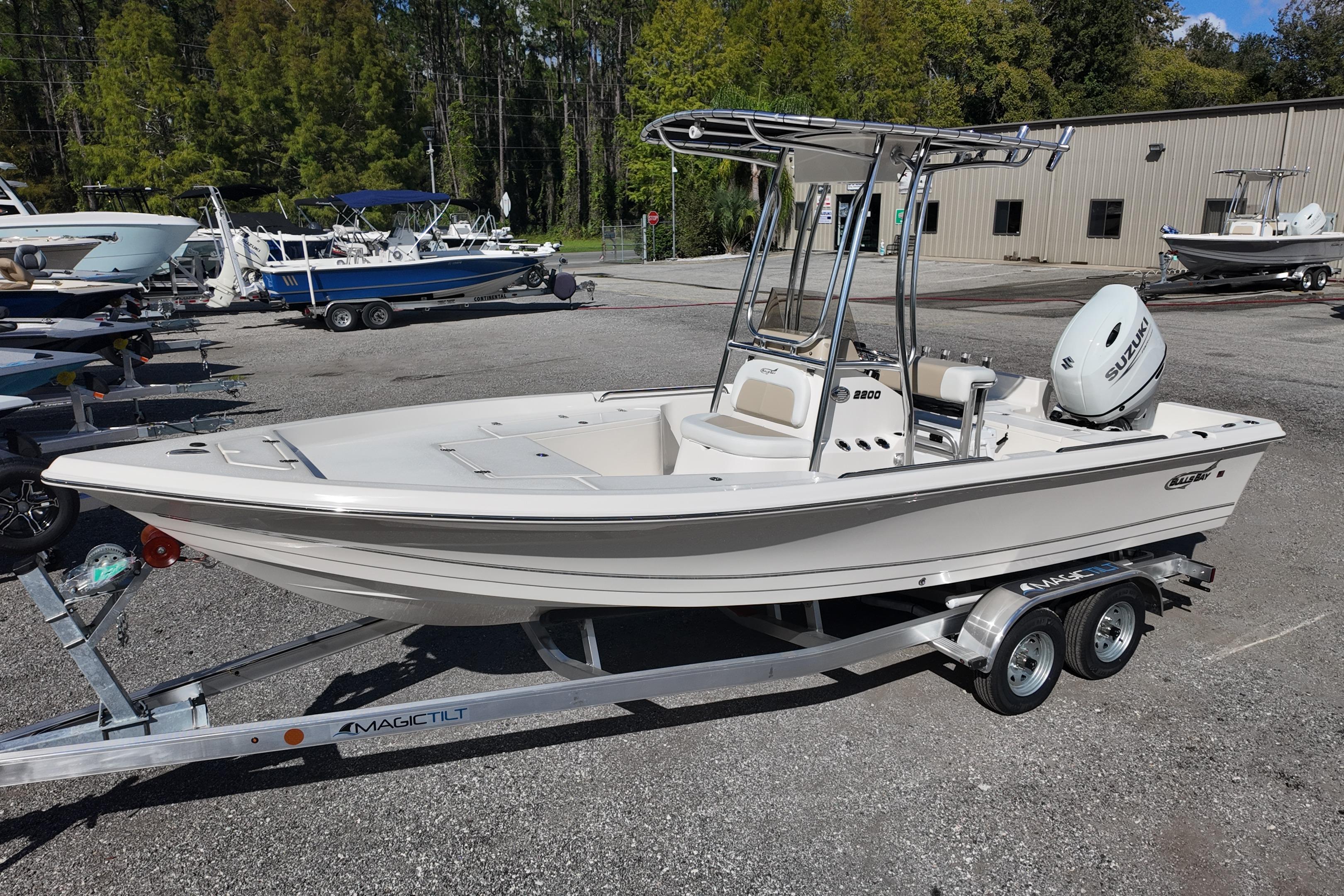 2026 Bulls Bay 2200 boat on trailer, parked outdoors near other boats.
