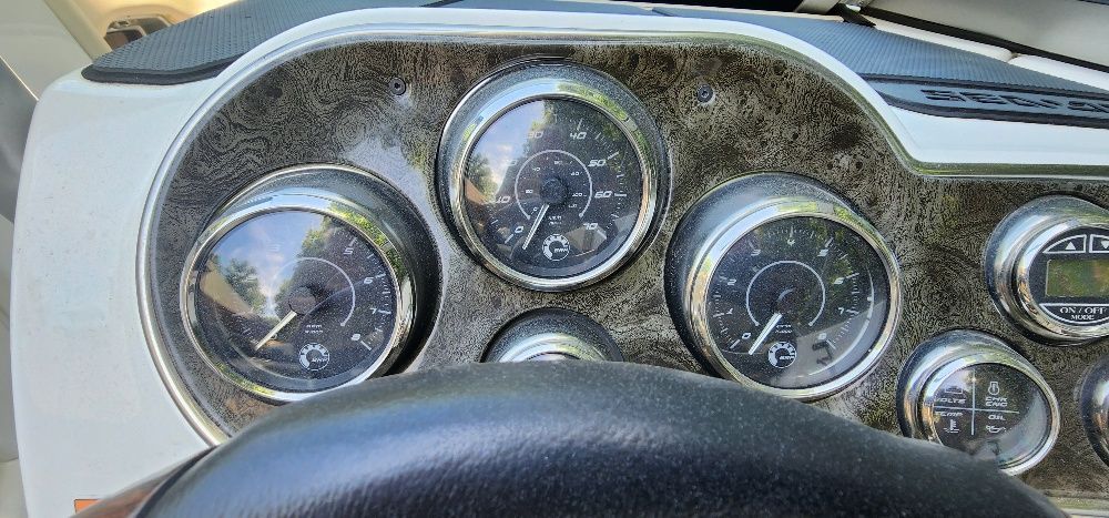 Dashboard of a 2007 Sea-Doo Sport Boats 230 Challenger SE with multiple gauges and controls.