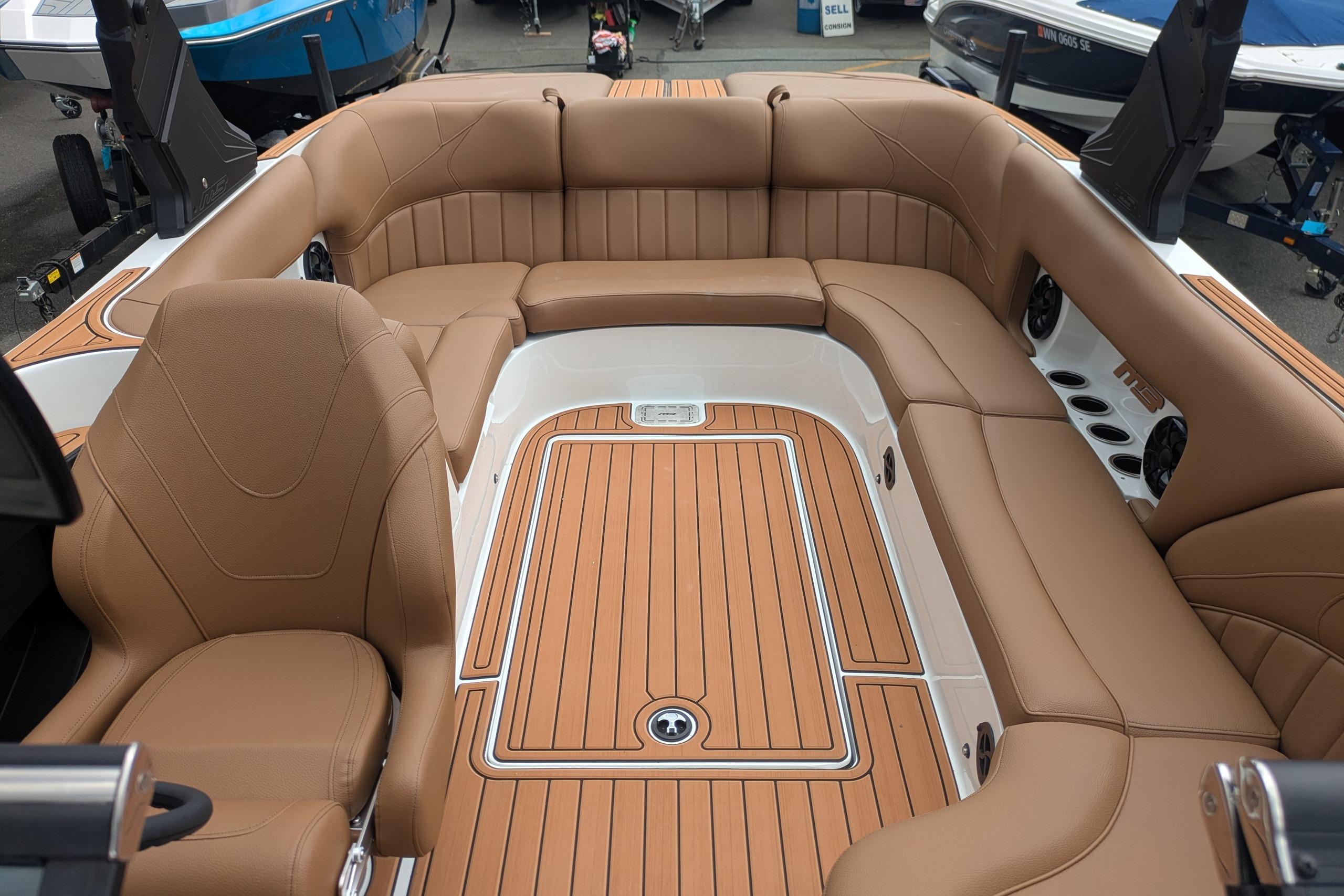 Luxurious interior of 2026 MB B52-23 Classic LIMITED boat with tan leather seating.