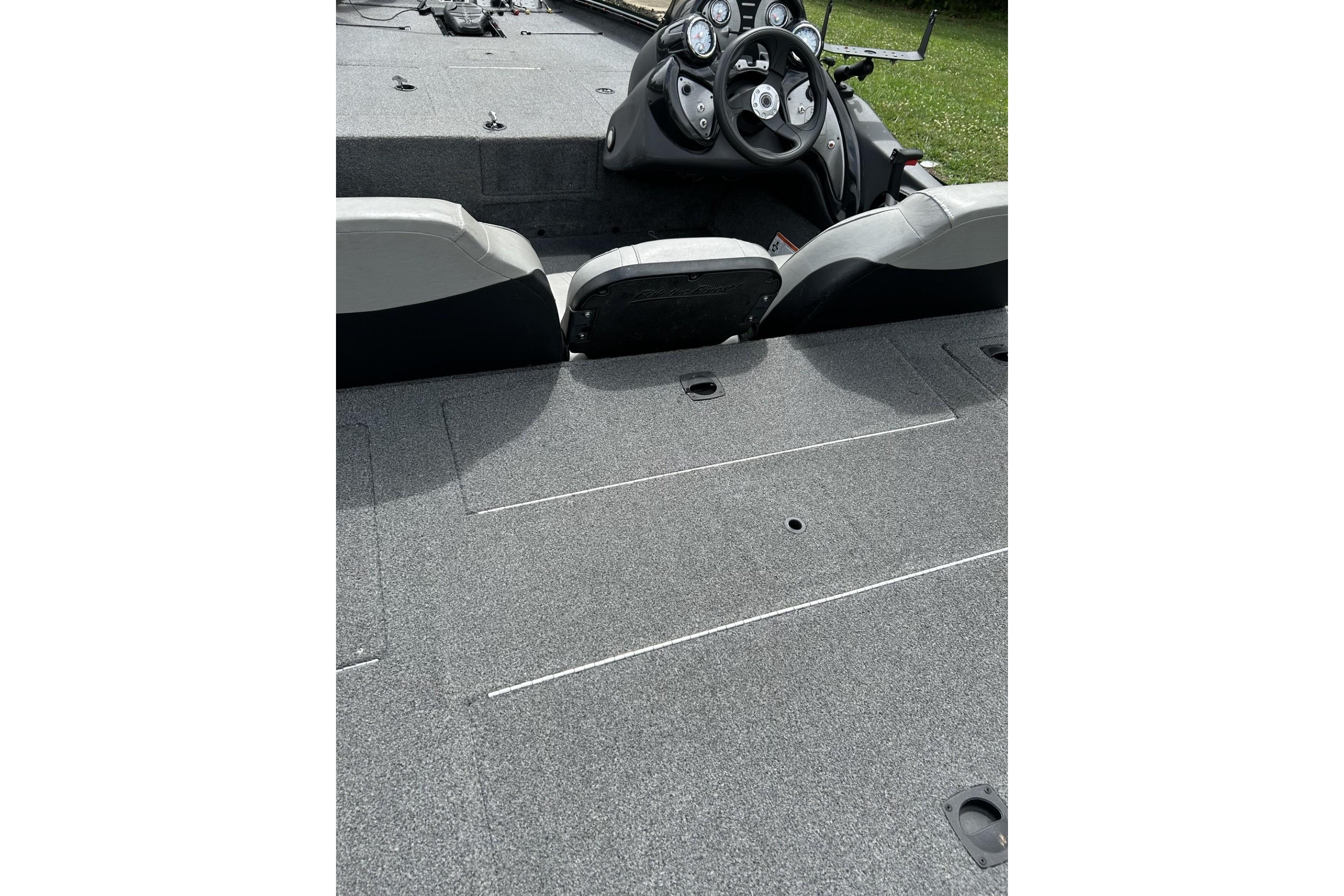 2022 Tracker Pro Team 175 TF boat interior with steering wheel and seating.