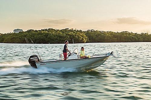2026 Boston Whaler 170 Montauk cruising on a serene lake at sunset.