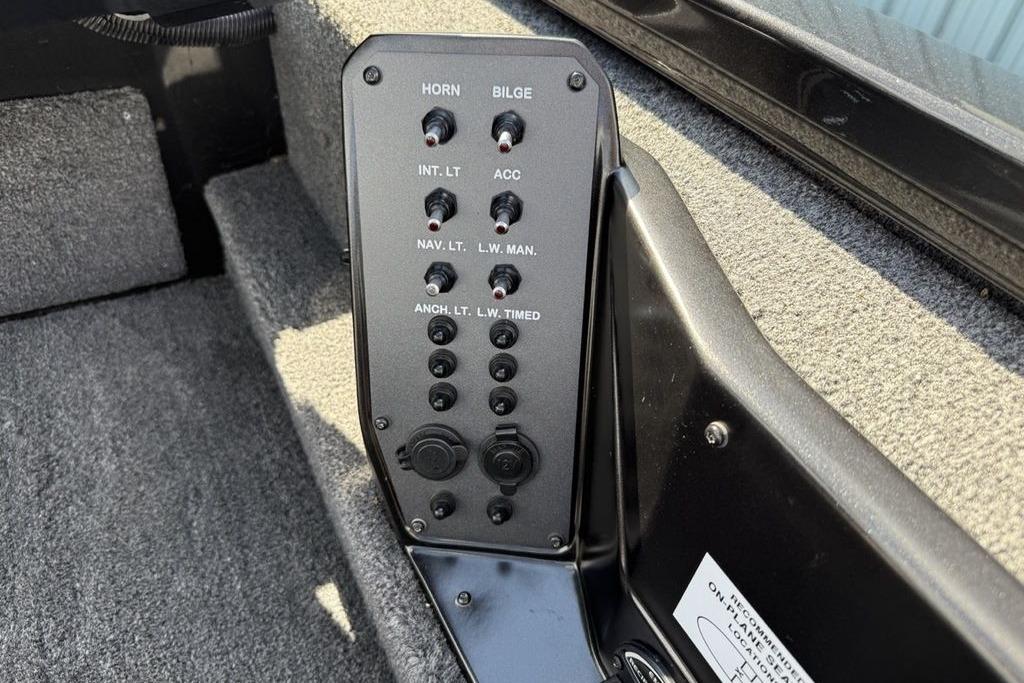 Control panel of 2023 Vexus AVX189 boat with switches for horn, bilge, and lights.