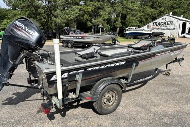 2015 Tracker Panfish 16 boat with Mercury engine on trailer, parked outdoors.