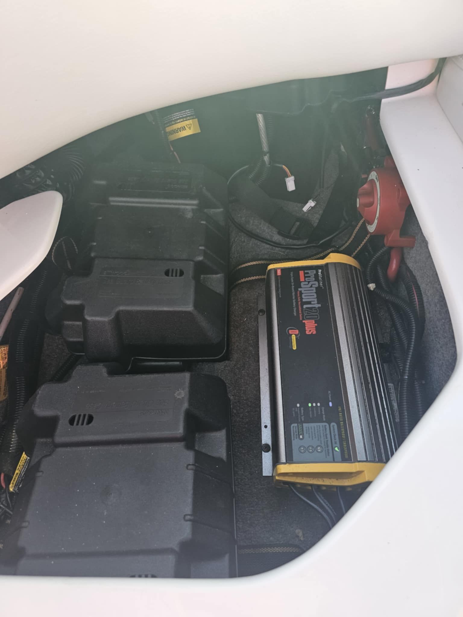 Battery compartment of a 2006 MB PIGPR with charger.