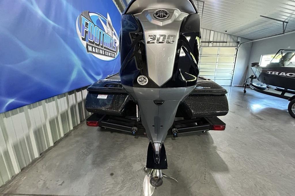 2026 Skeeter ZX200 boat in showroom, featuring sleek design and powerful engine.
