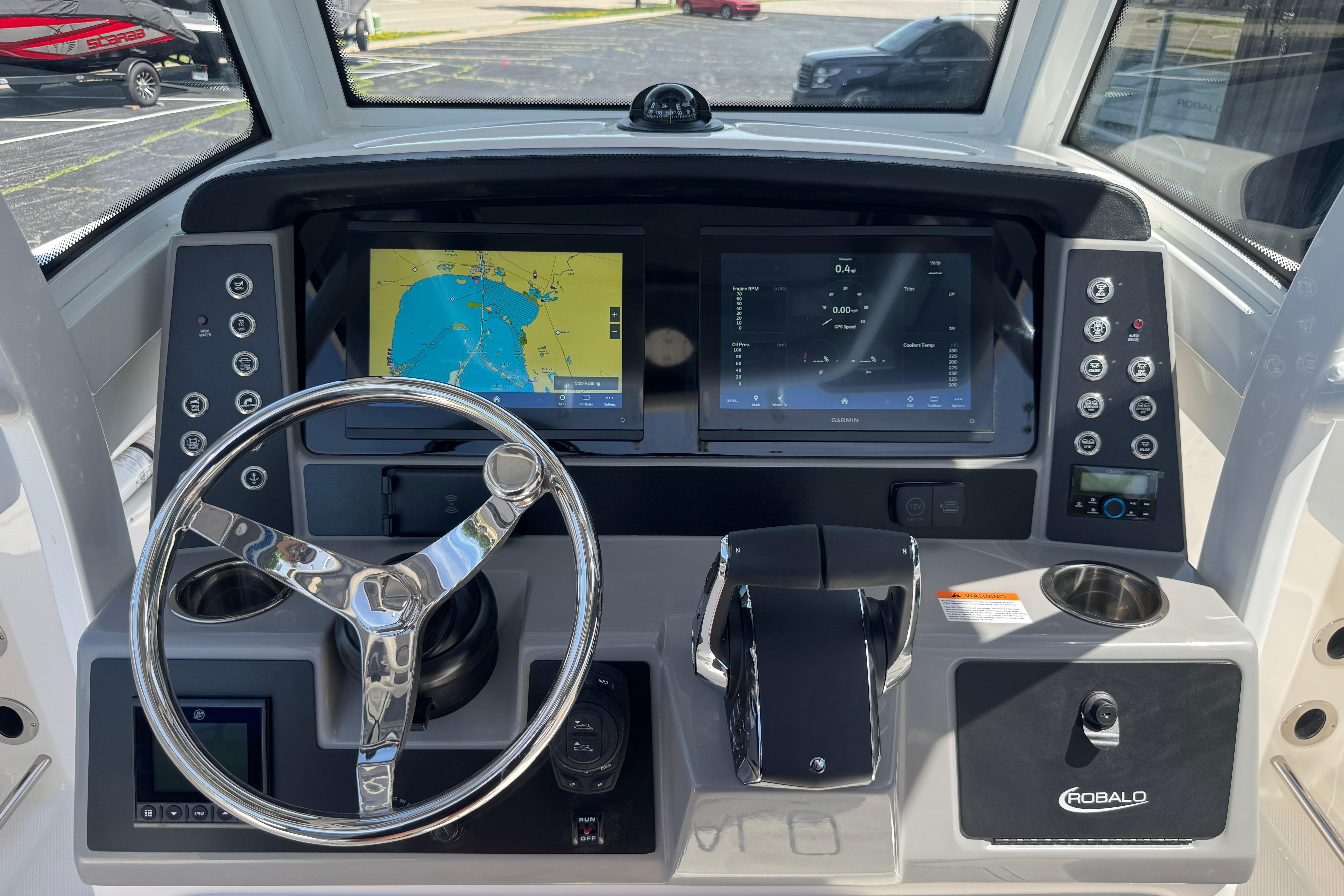 2026 Robalo R250 Center Console dashboard with steering wheel and navigation screens.