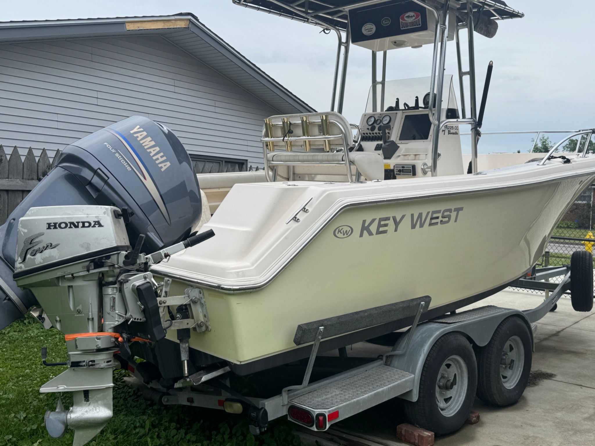 2007 Key West Blue Water 225 boat on trailer with Yamaha and Honda engines.