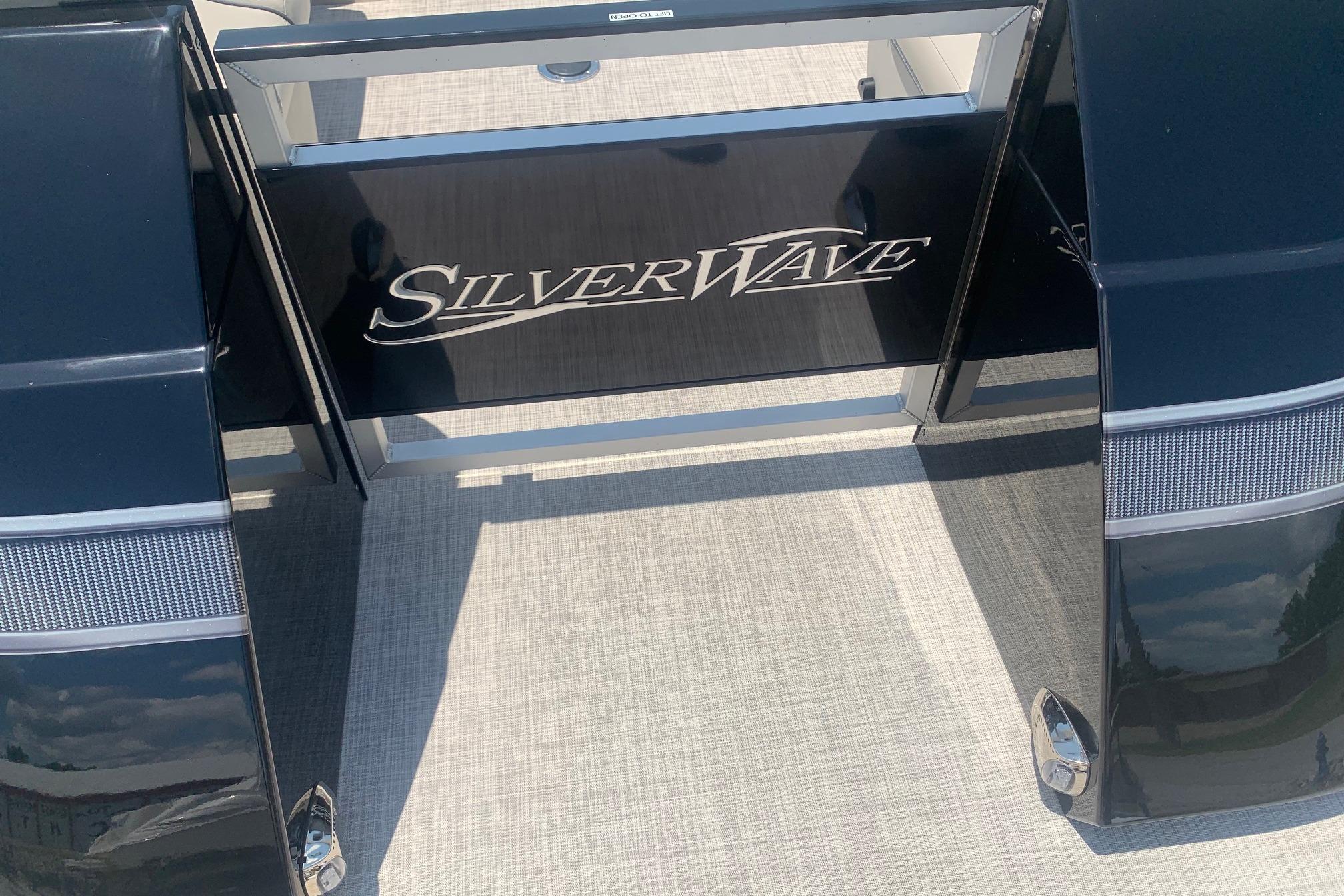 2023 Silver Wave 2410 SW3 CLS boat deck with logo in sunlight.