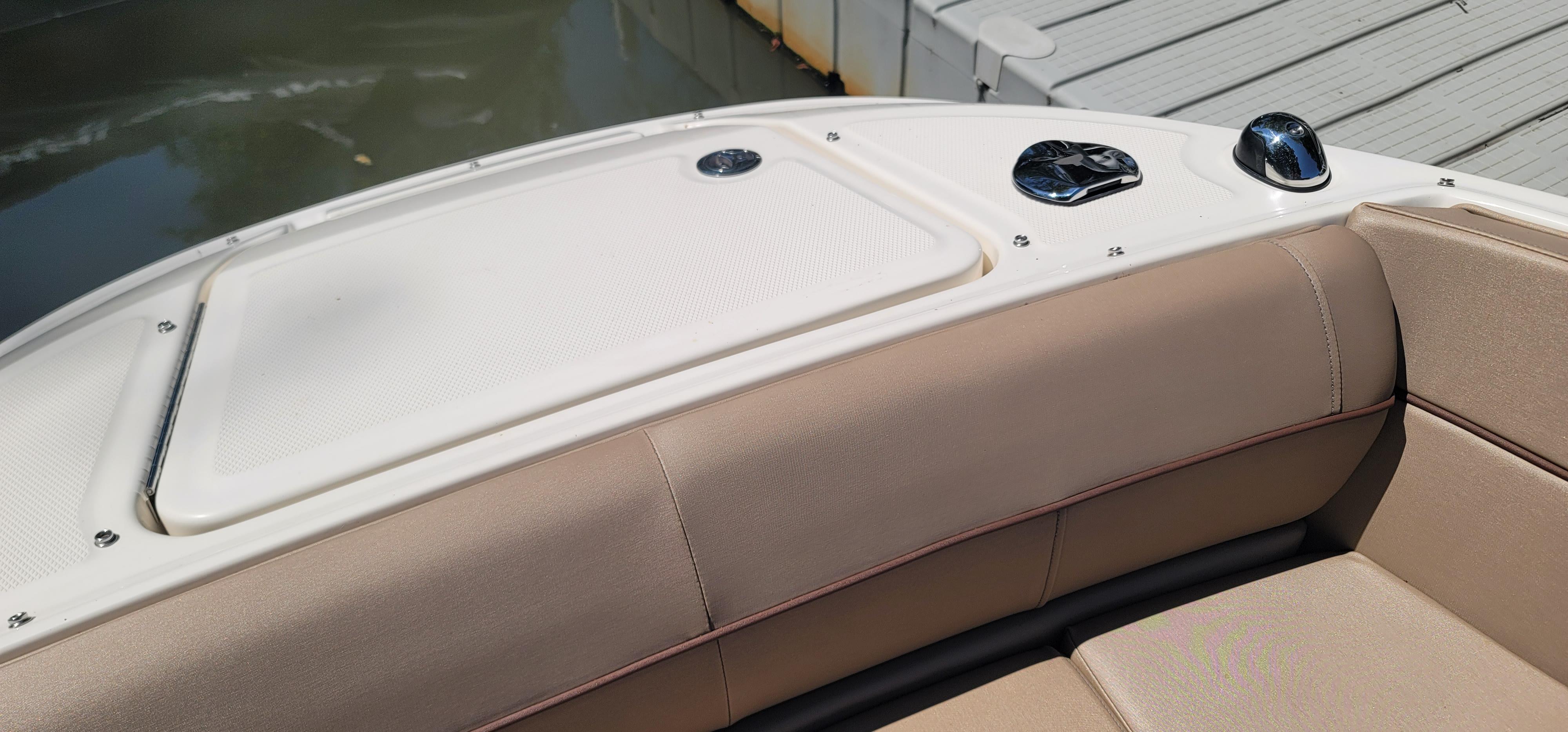 2017 Sea Ray SDX 240 Outboard boat with beige seating and white deck.