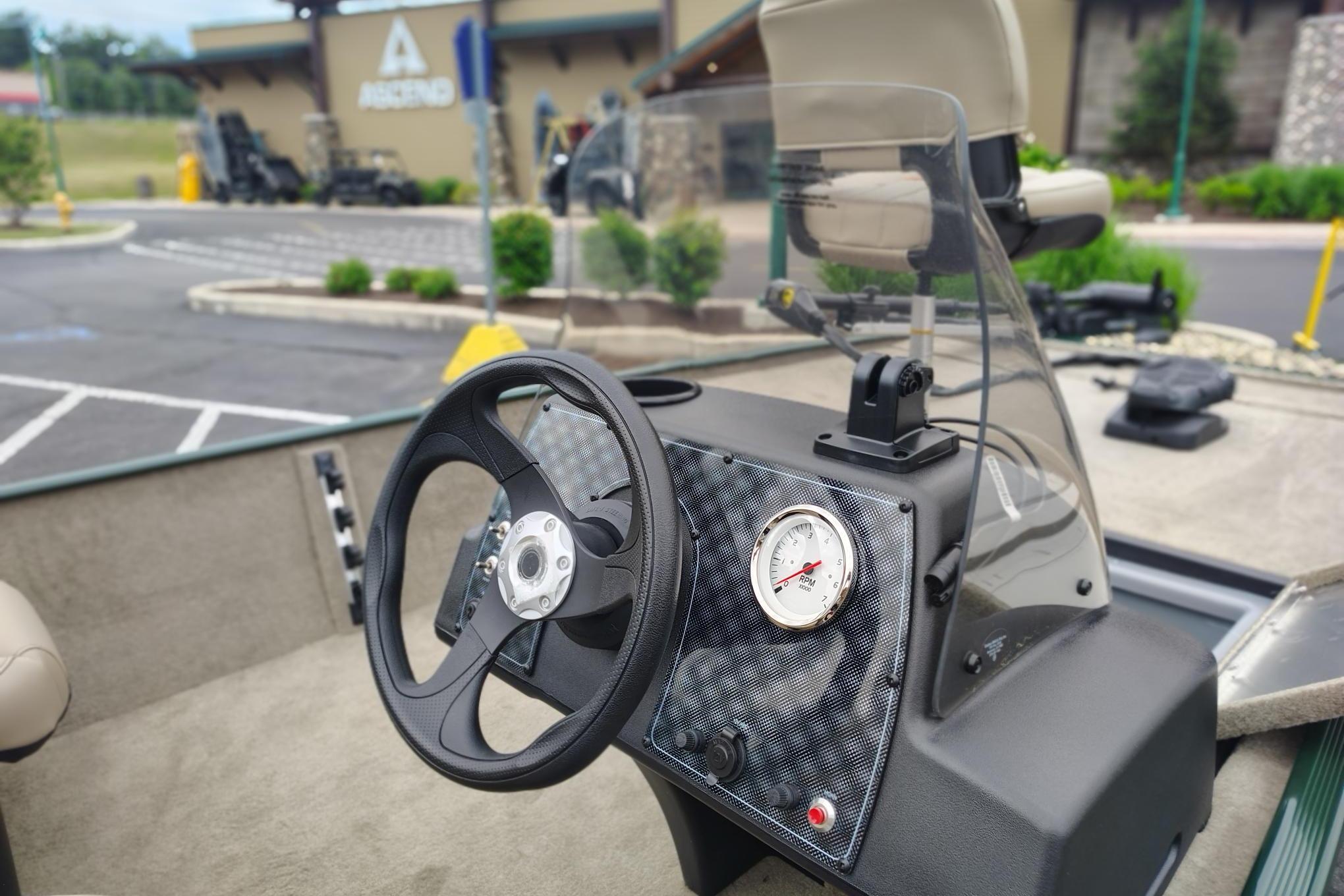 2026 Tracker Bass Tracker Classic Limited boat dashboard with steering wheel and gauge.