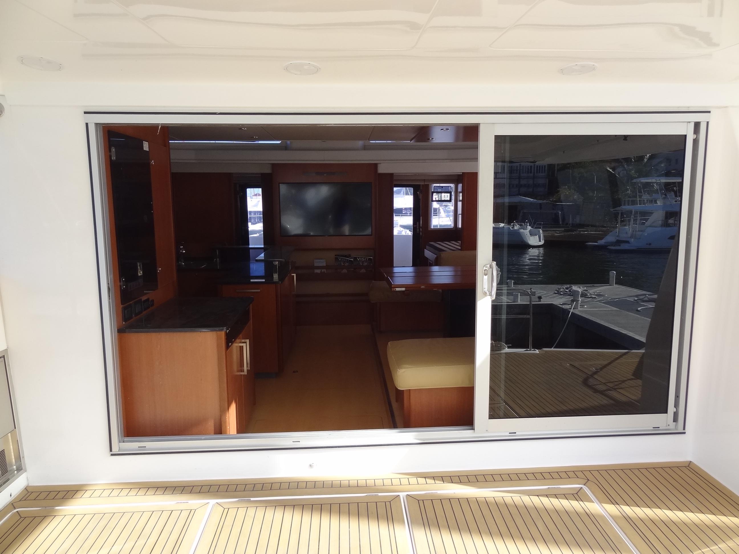 Interior view of 2014 Leopard 58 yacht with sliding glass door.
