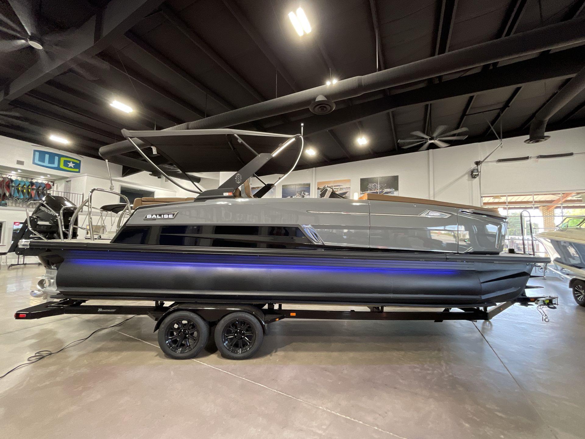 2025 Balise Horizon 26C boat displayed indoors on a trailer.