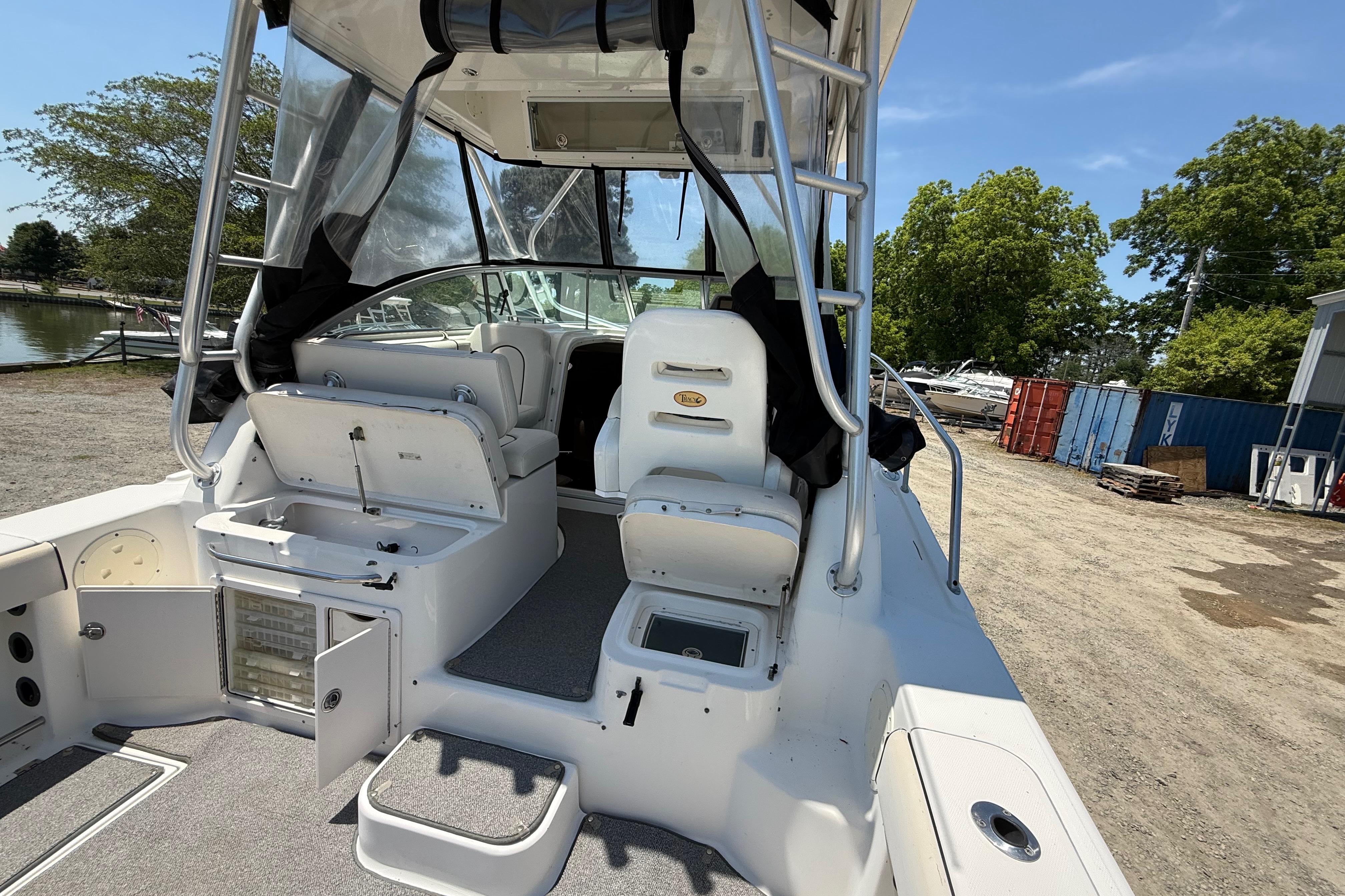 2007 Robalo R305 Walkaround boat interior with seating and storage compartments.