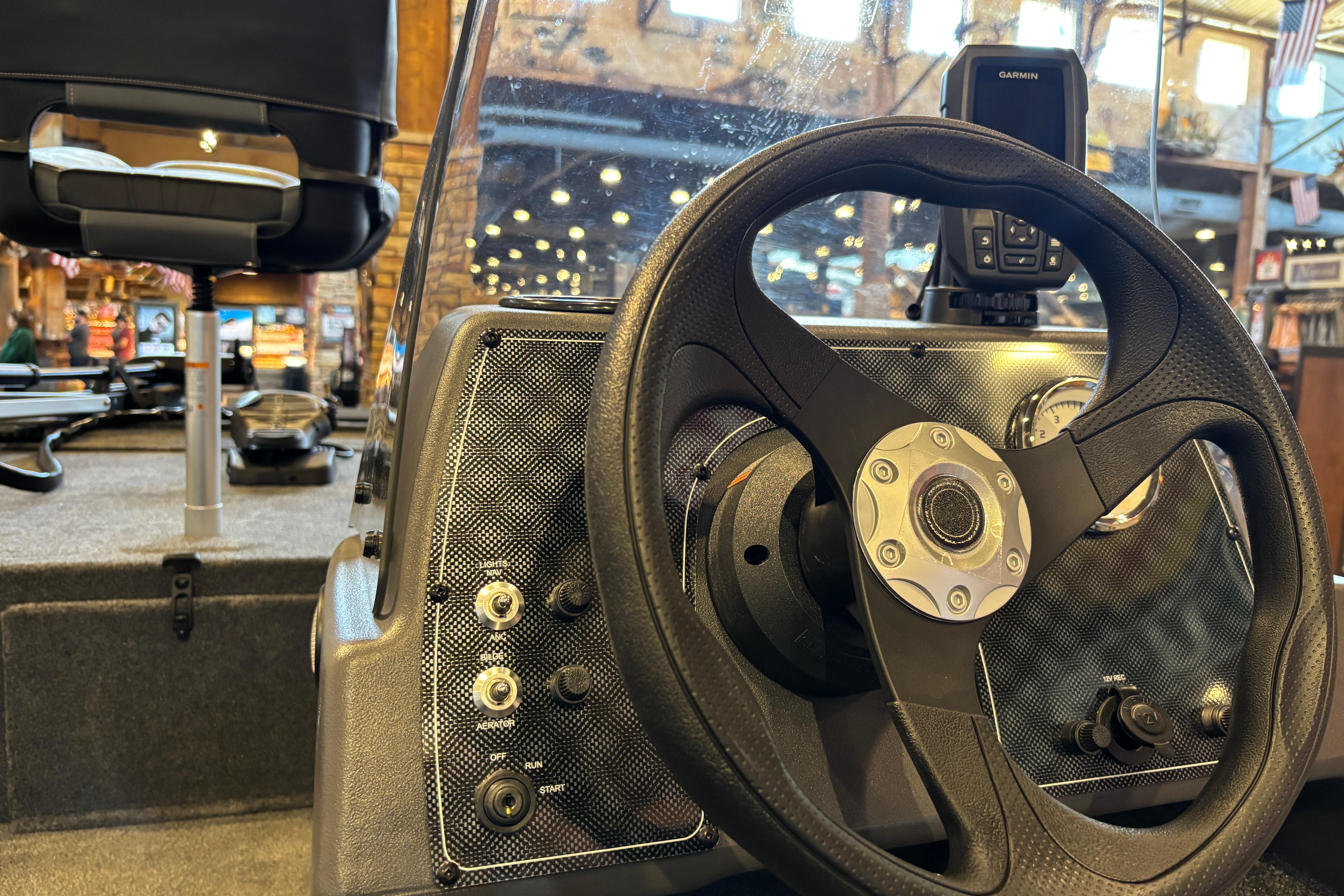 2026 Tracker Bass Tracker Classic XL boat dashboard with steering wheel and controls.