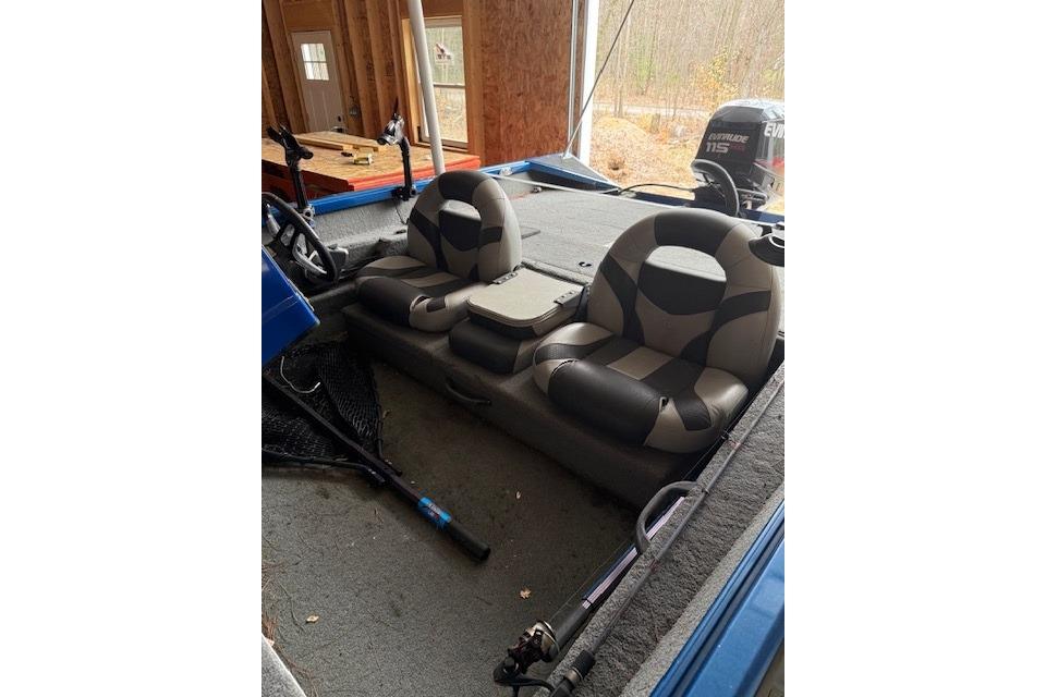 2018 Alumacraft Pro 185 boat interior with dual seats and fishing gear.