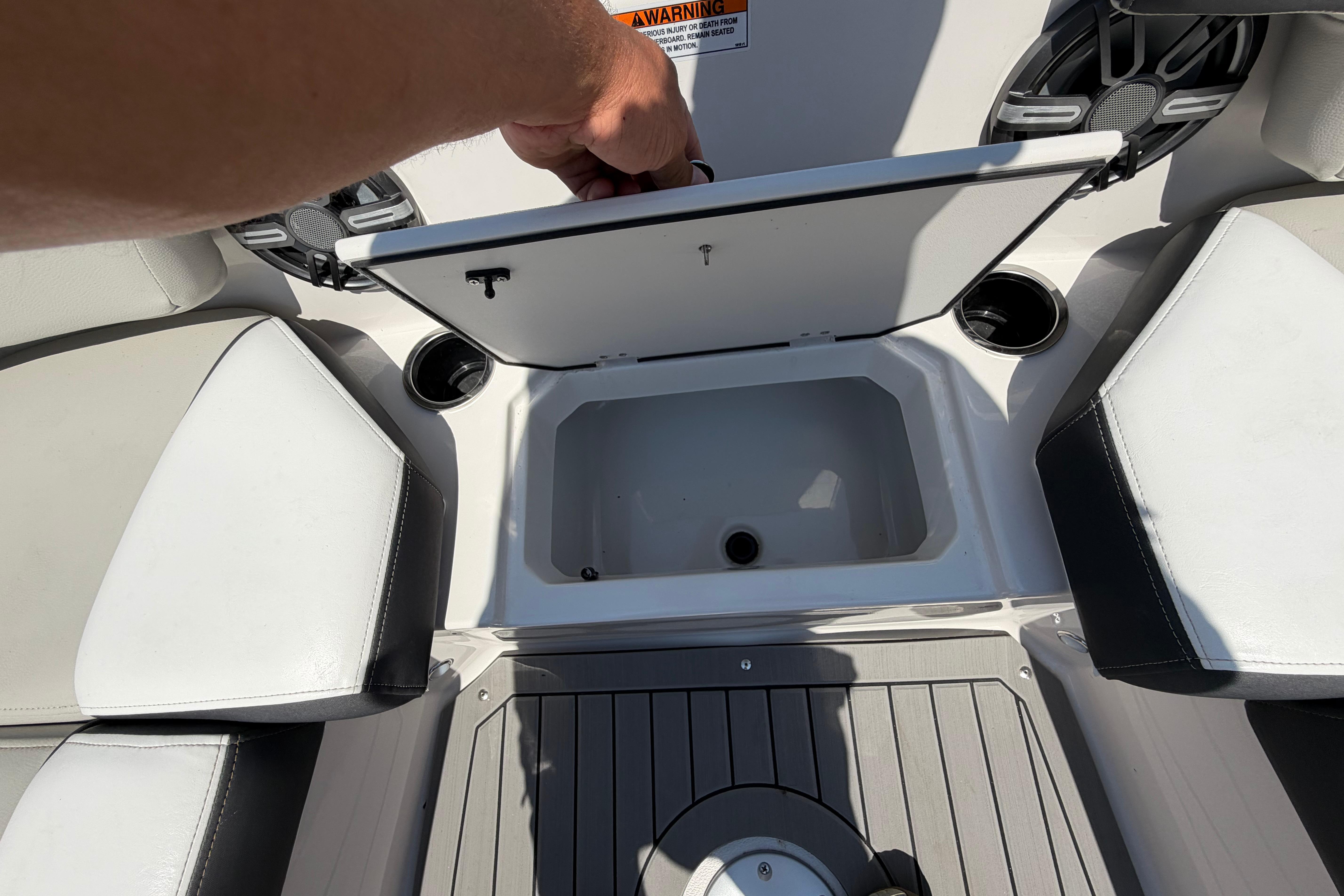 2025 Starcraft SVX 190 OB boat interior with open storage compartment and seating.