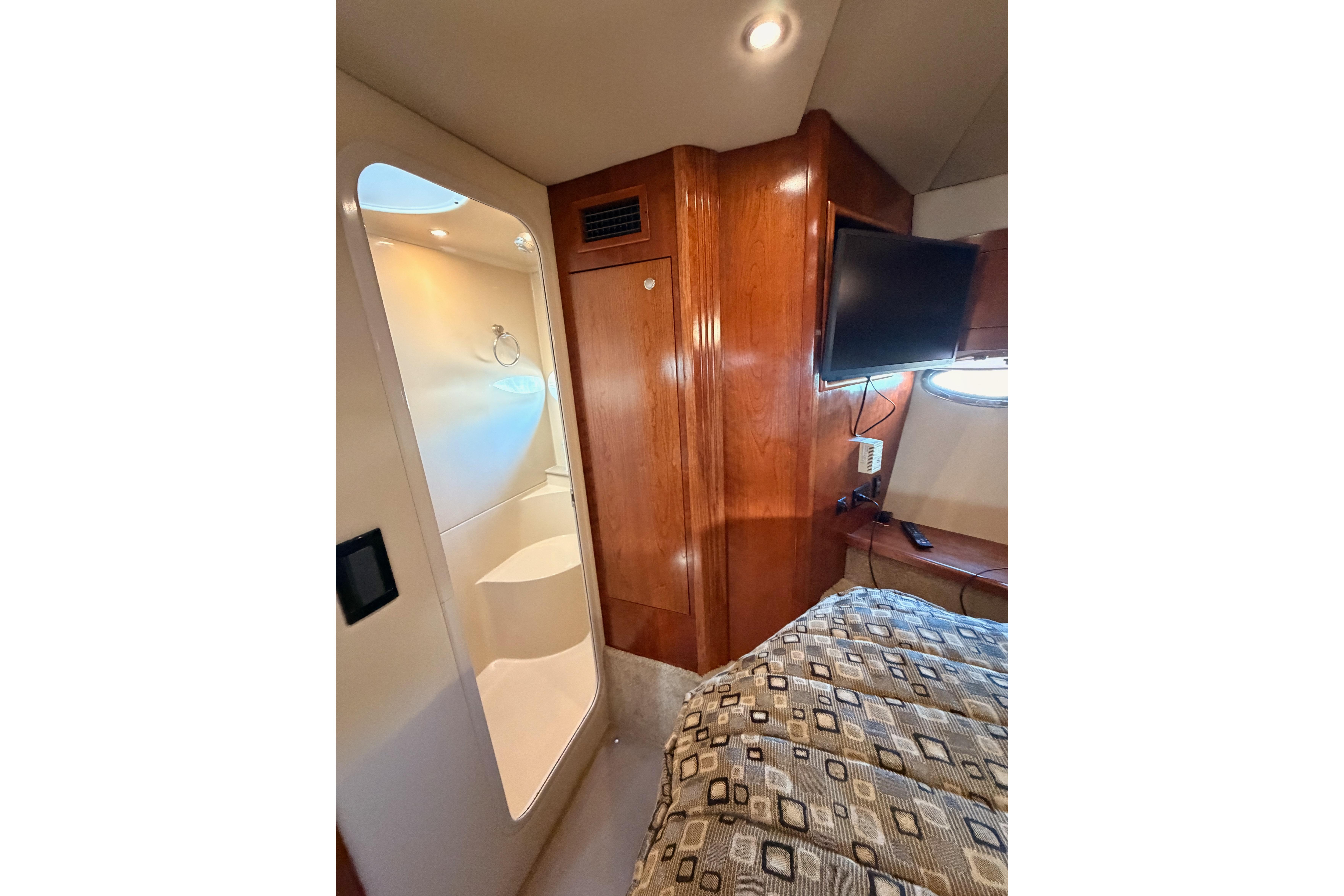 Luxurious 2005 Cruisers Yachts 405 Express Motoryacht interior with wood paneling and modern amenities.