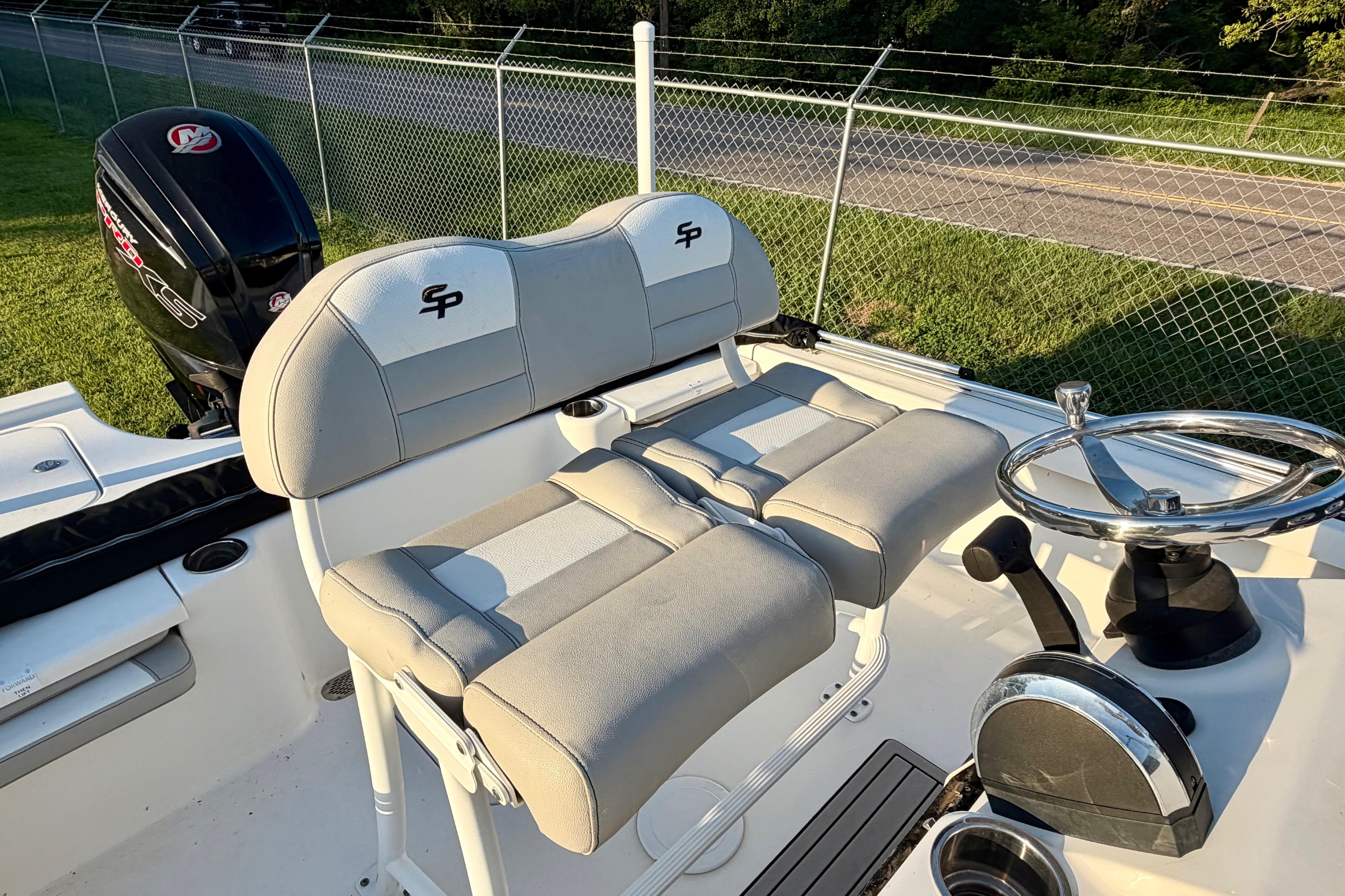 2018 Sea Pro 208 Bay boat interior with dual seats and steering wheel.